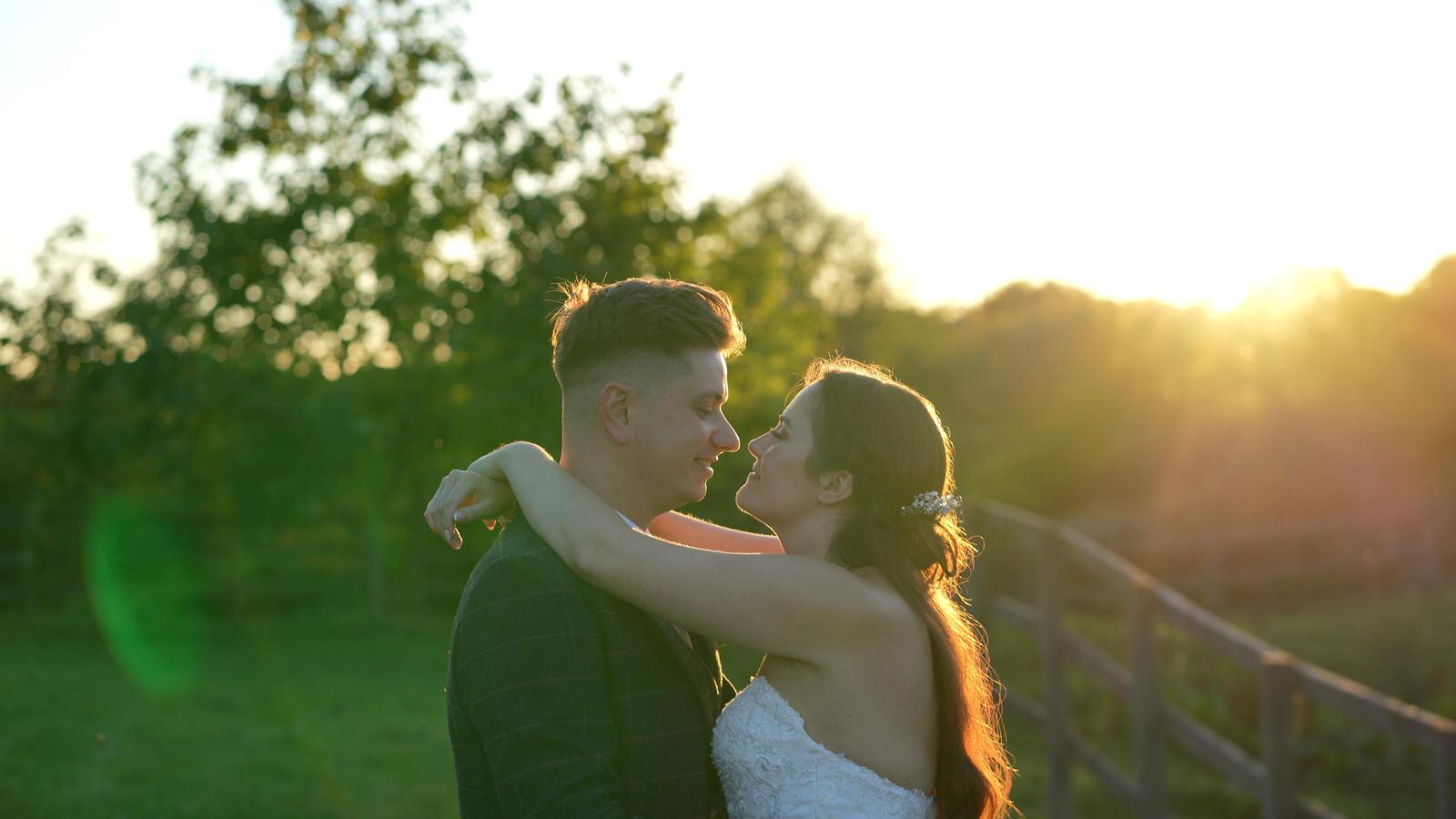 relaxed moment for the video of couple kissing at sunset