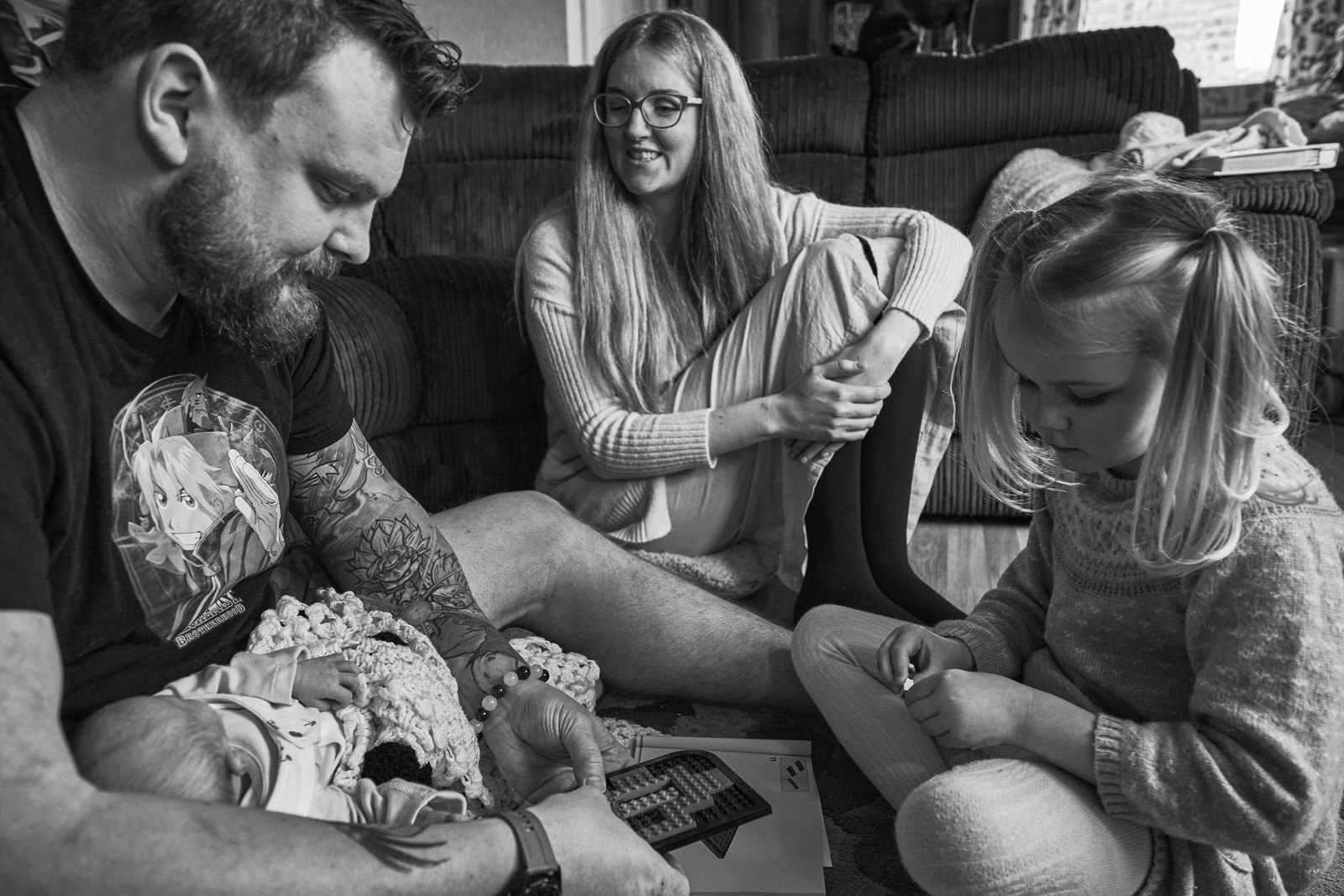 natural family photo playing on the living room floor