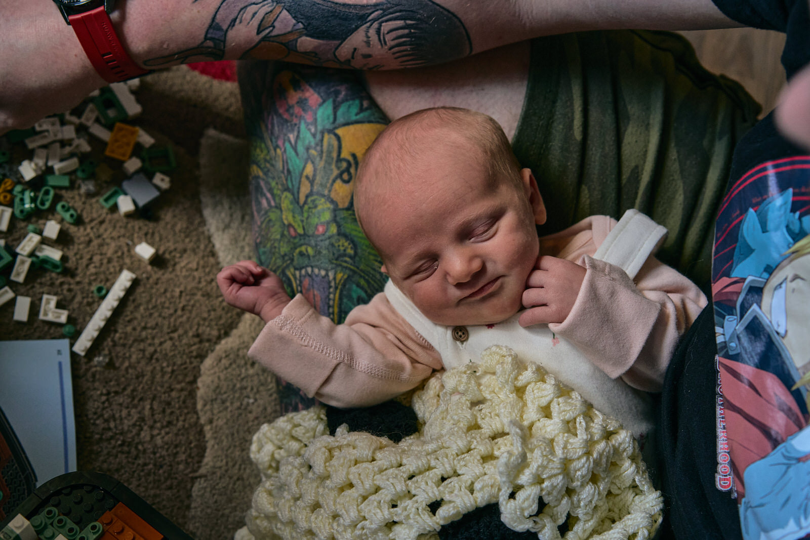 baby smiles in their sleep for the family photographer