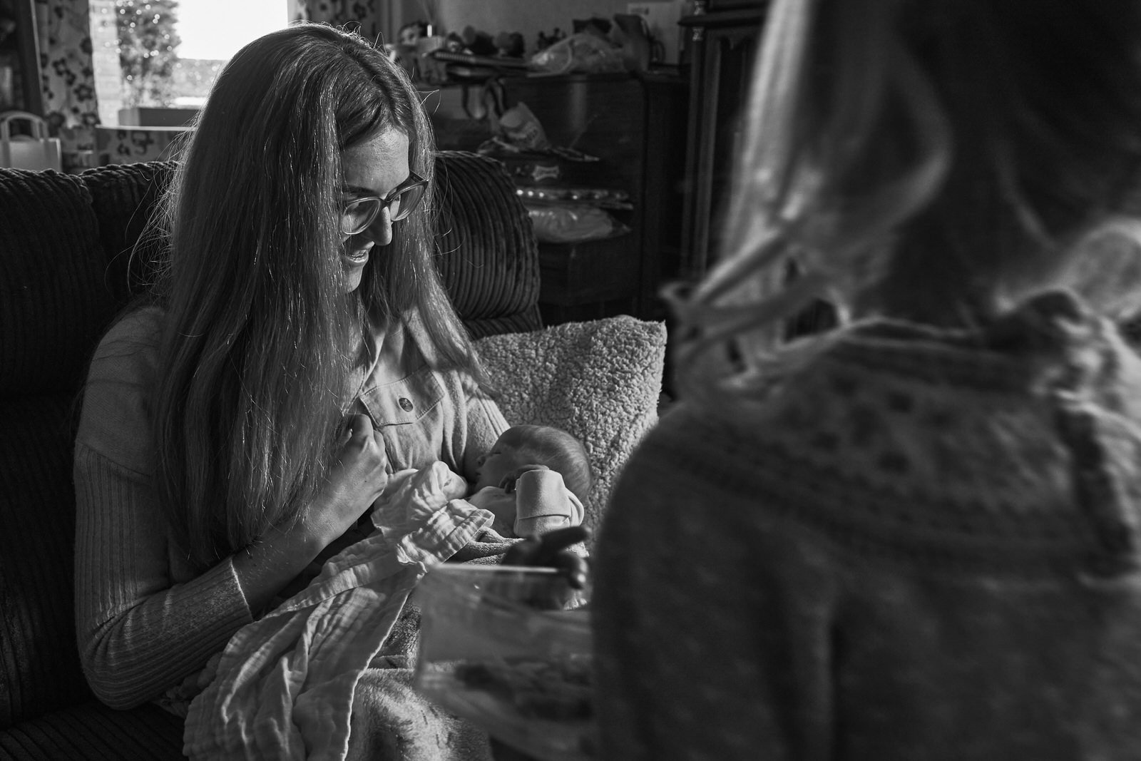 candid photo of mum looking at baby during photoshoot