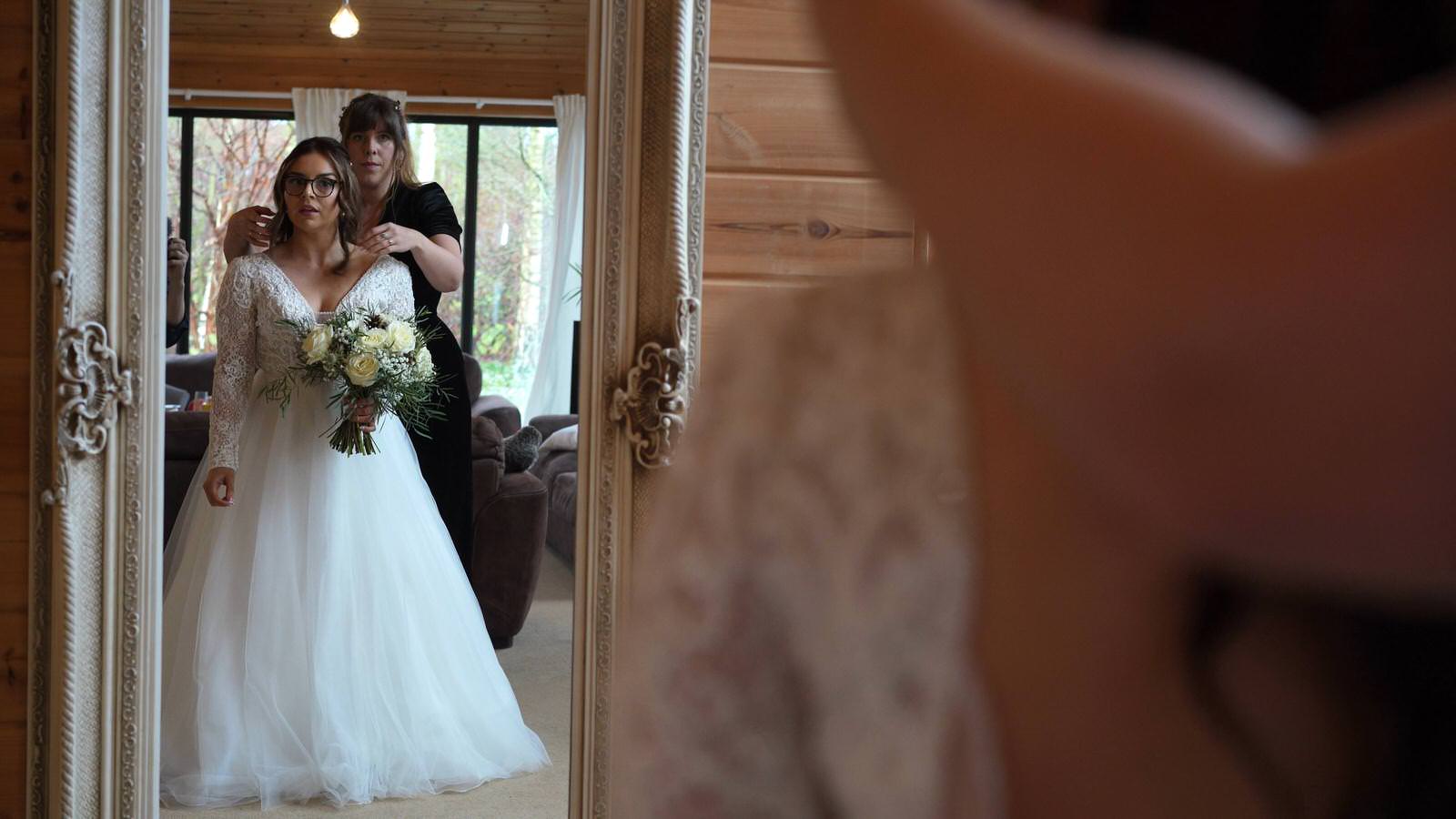 video still of brides reflection in mirror at Styal Lodge