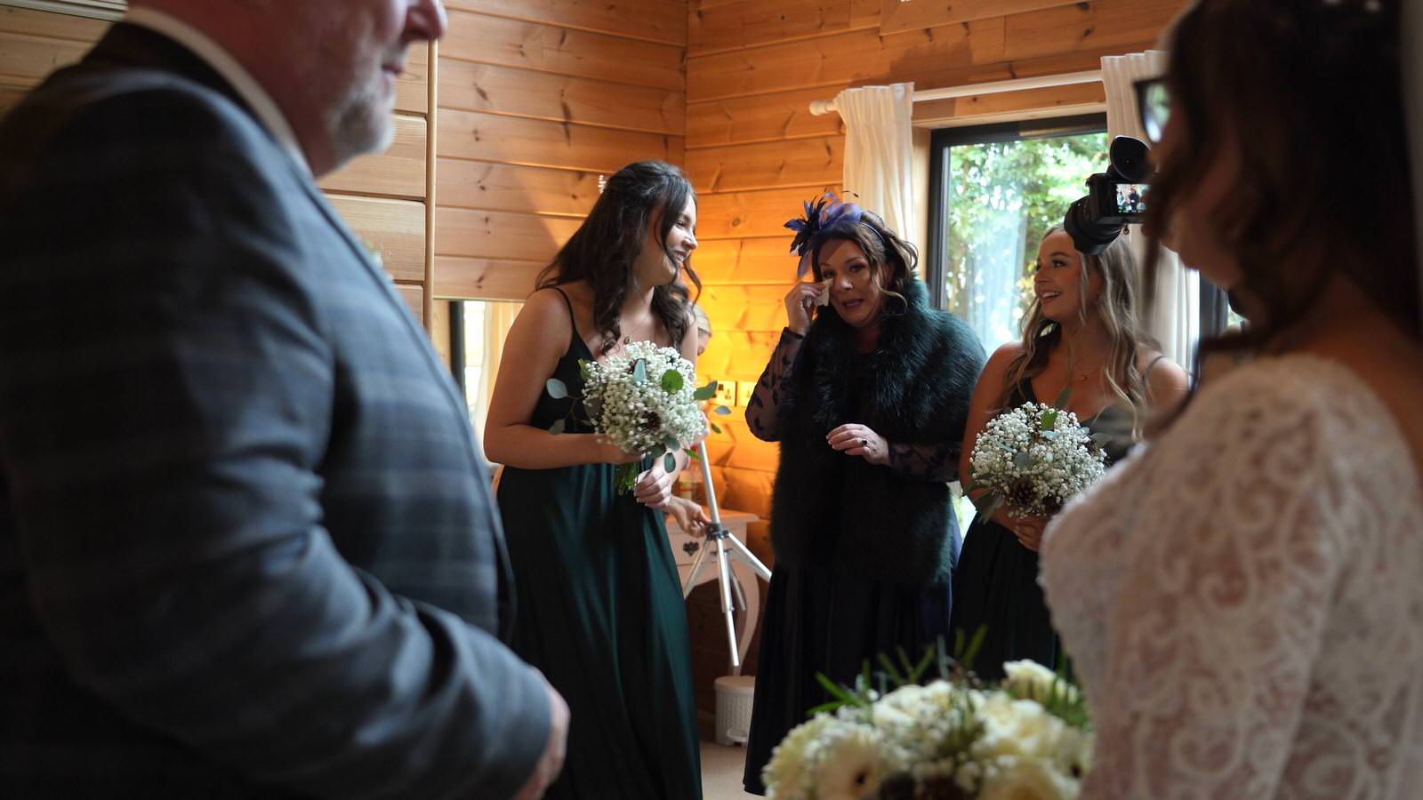 mum wipes away tears during wedding morning at Styal Lodge