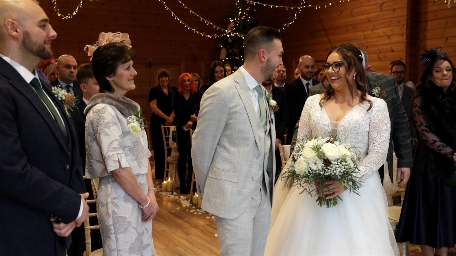 Bride and groom smile during wedding ceremony