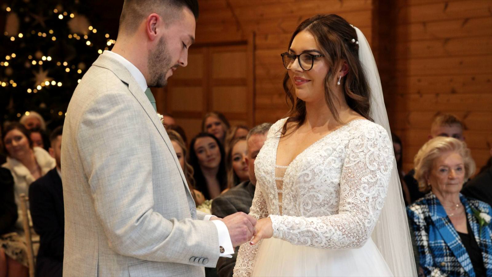 couple exchange their wedding rings during Styal Lodge wedding ceremony
