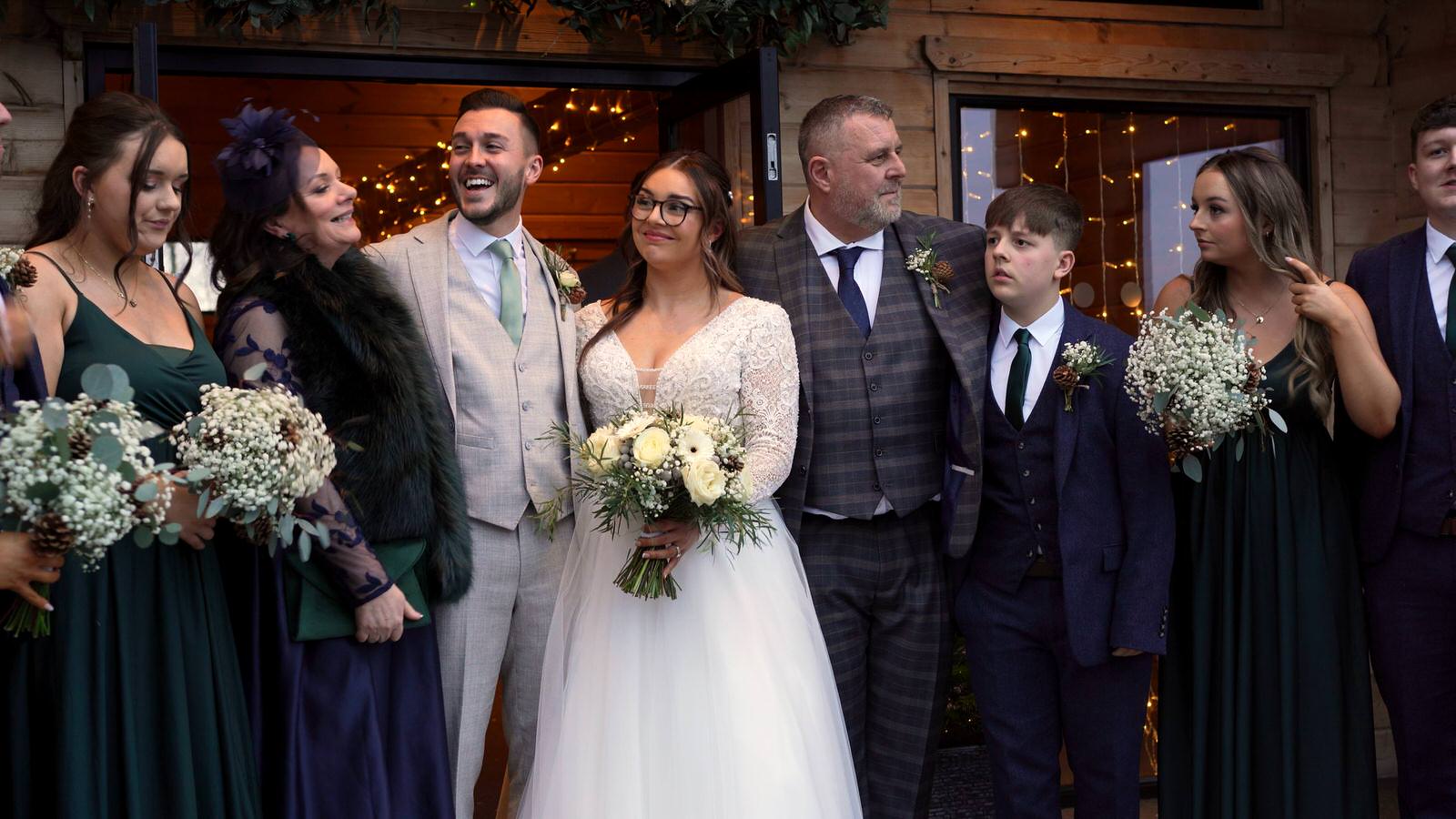 family cuddle in for a winter family photo outside styal lodge