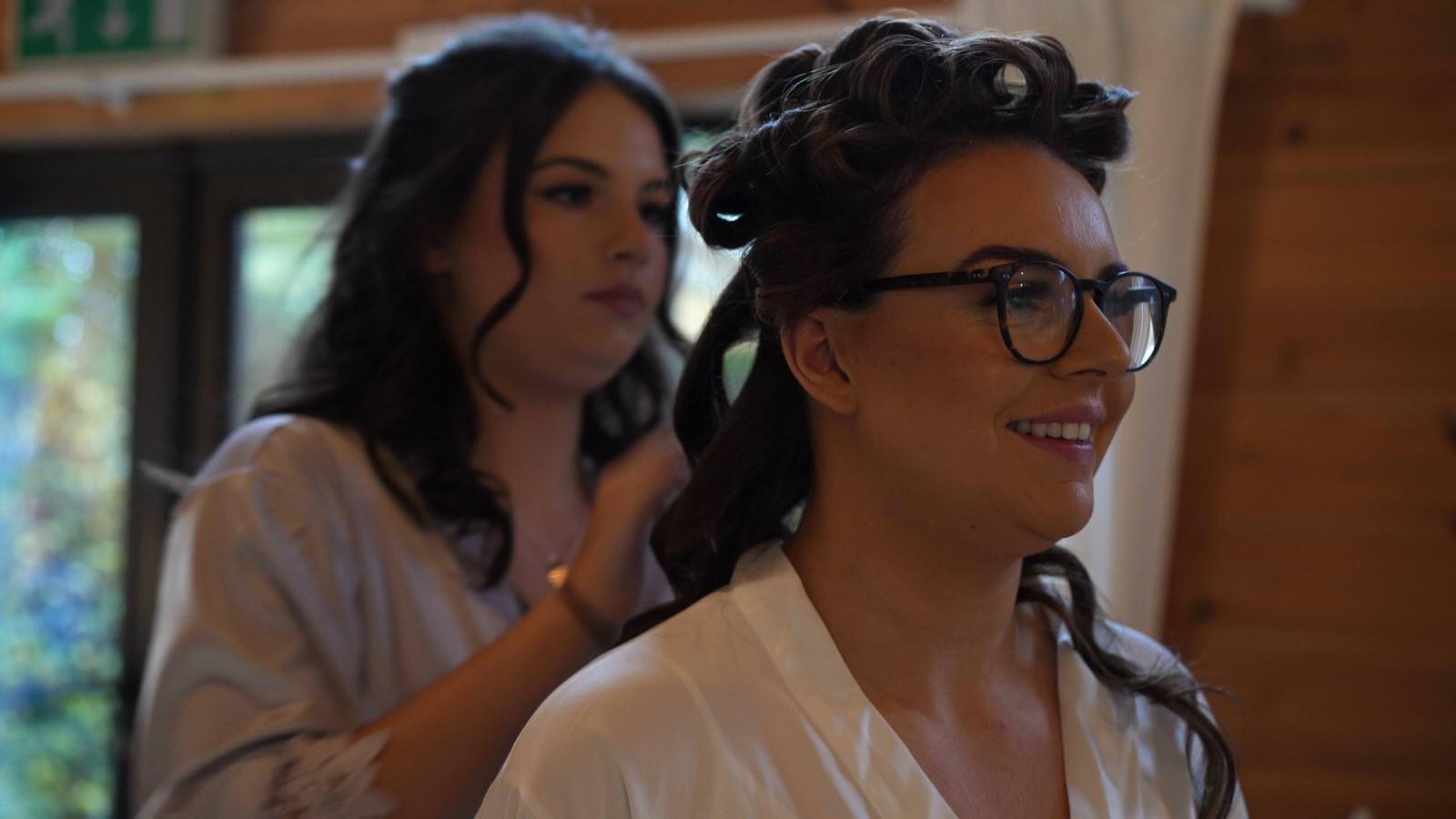 bride smiles on the morning of her wedding