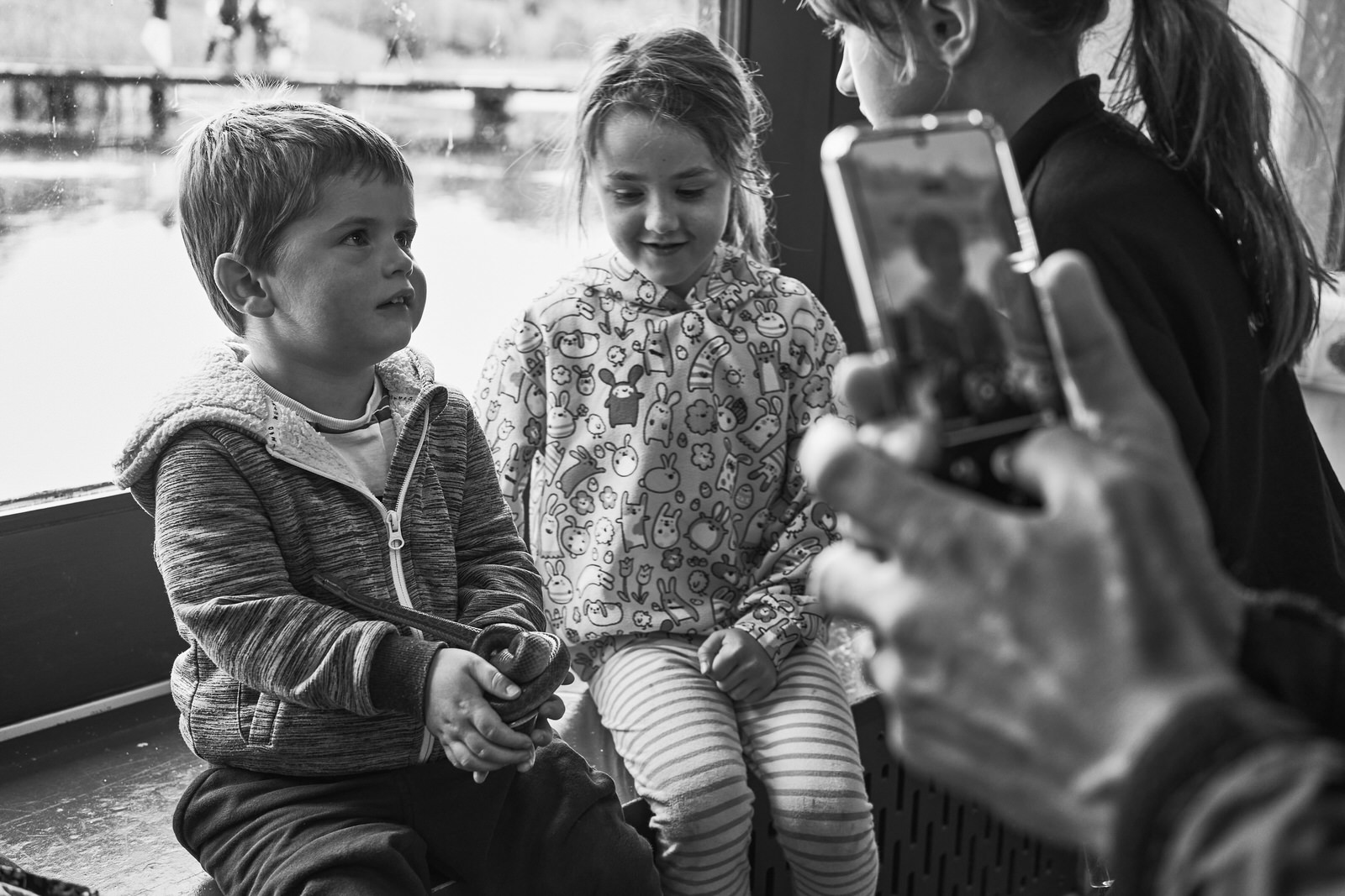 a documentary photo of children at a reptile event at Brockholes
