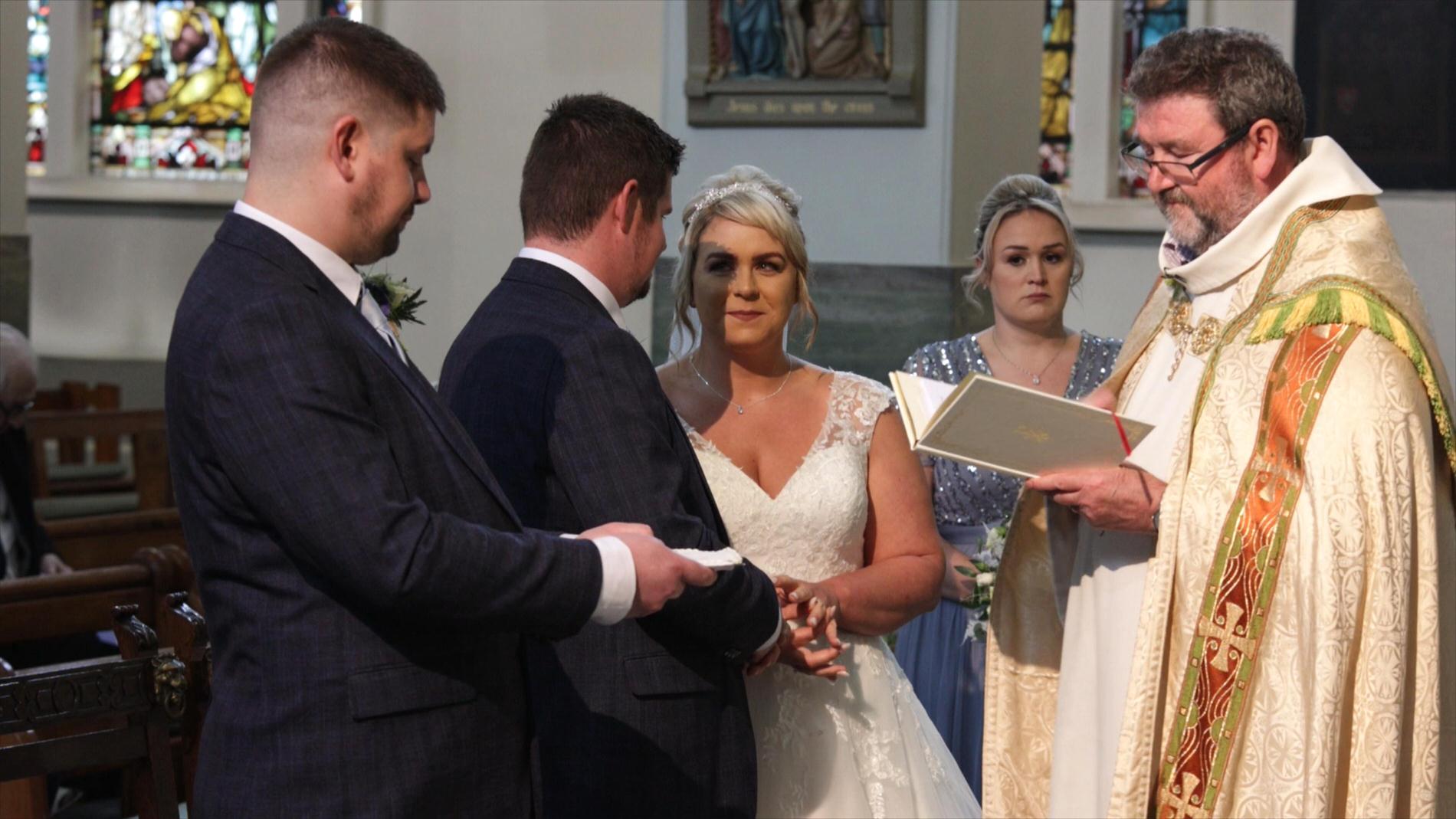 a couple exchange their wedding rings