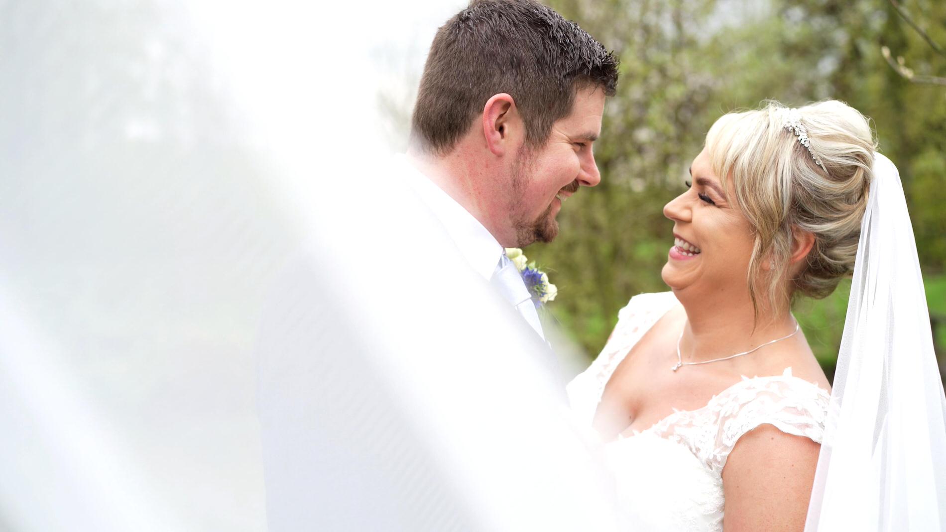 a couple laugh as the videographer films them at Charnock farm