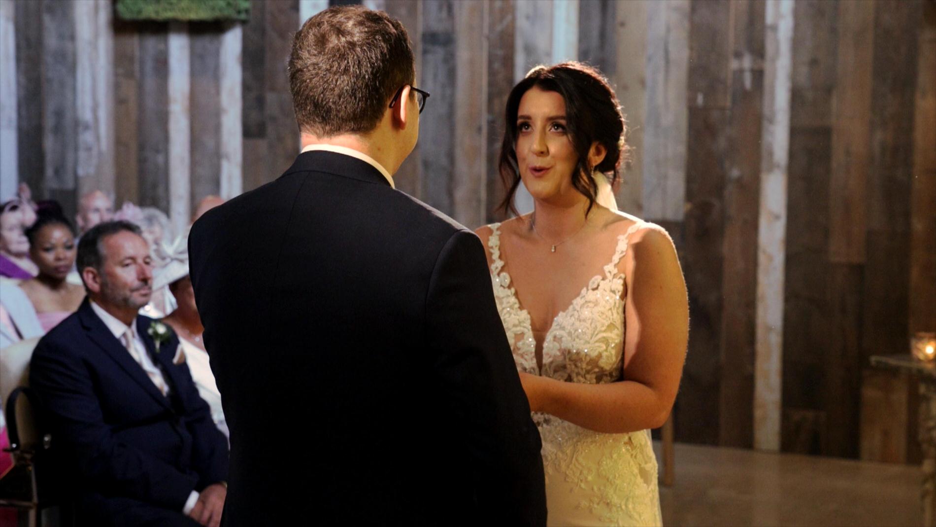 bride takes a deep breath during the wedding ceremony