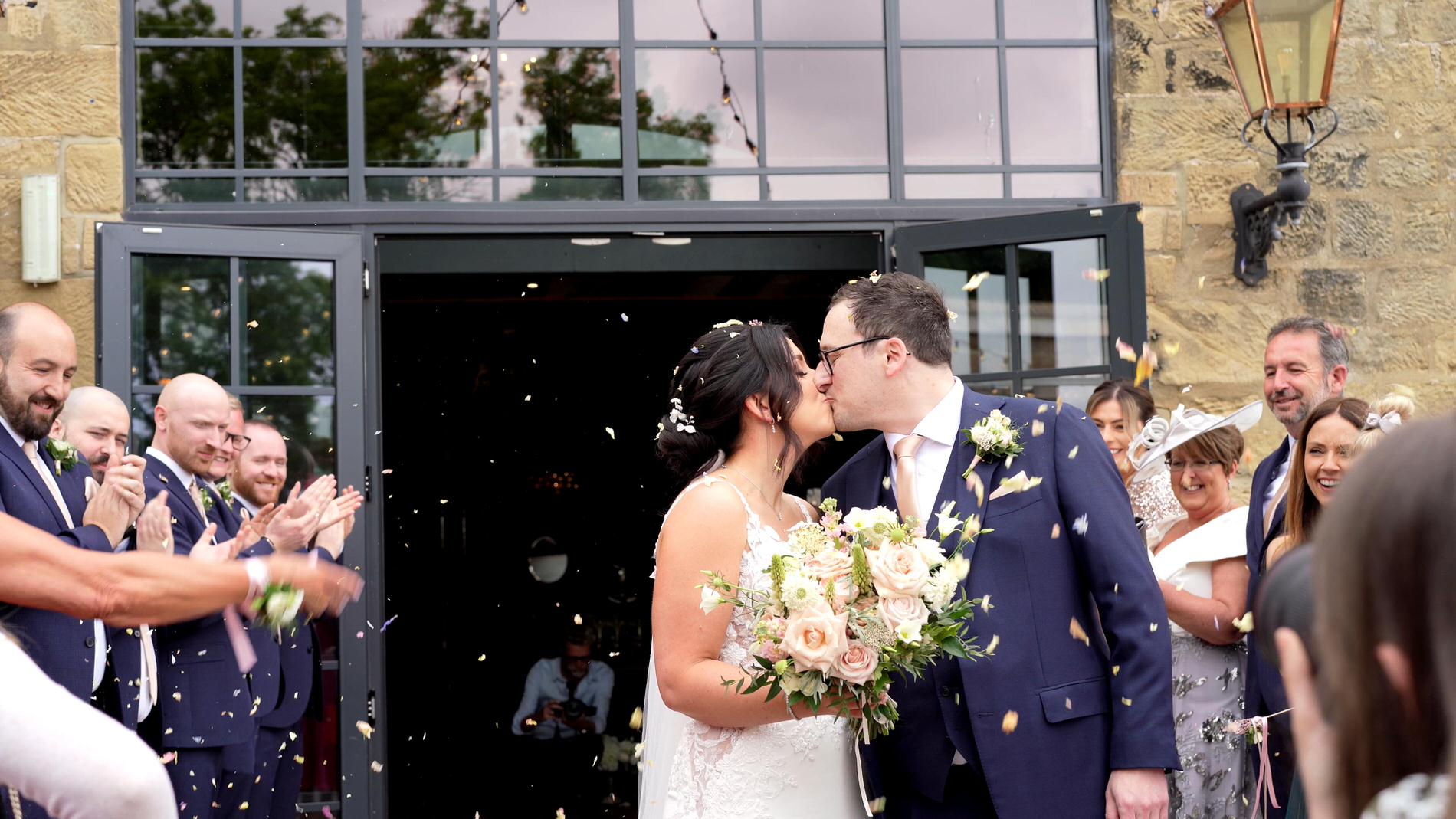 a couple kiss outside Wharfdale Grange in Yorkshire