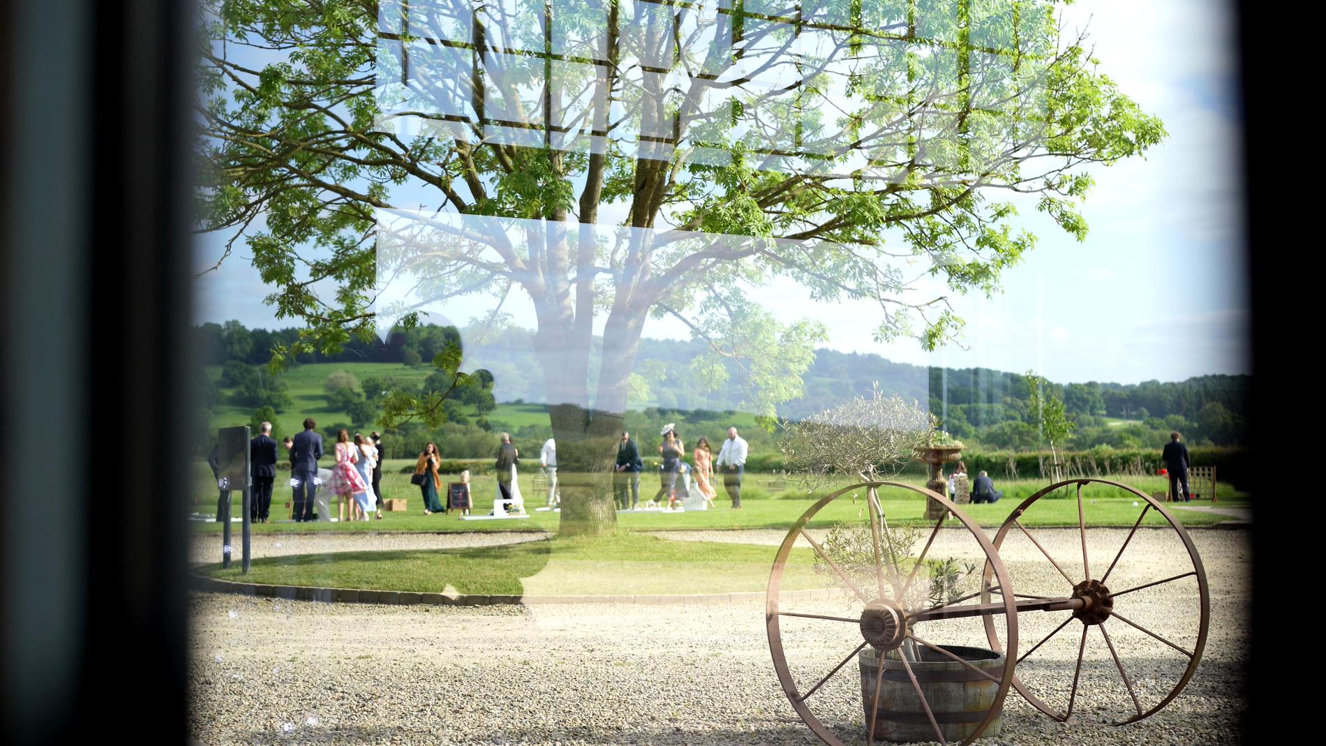 creative video still of garden games through a window at Wharfdale Grange