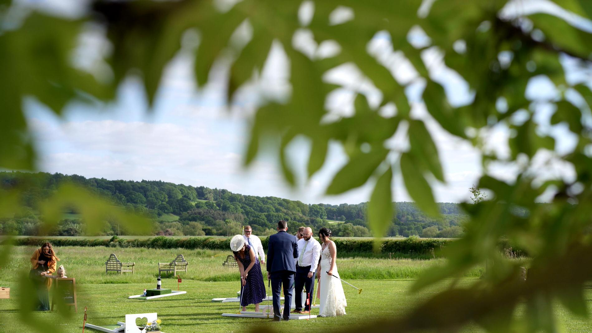 guests enjoy miniature golf outside at Wharfdale Grange in Yorkshire