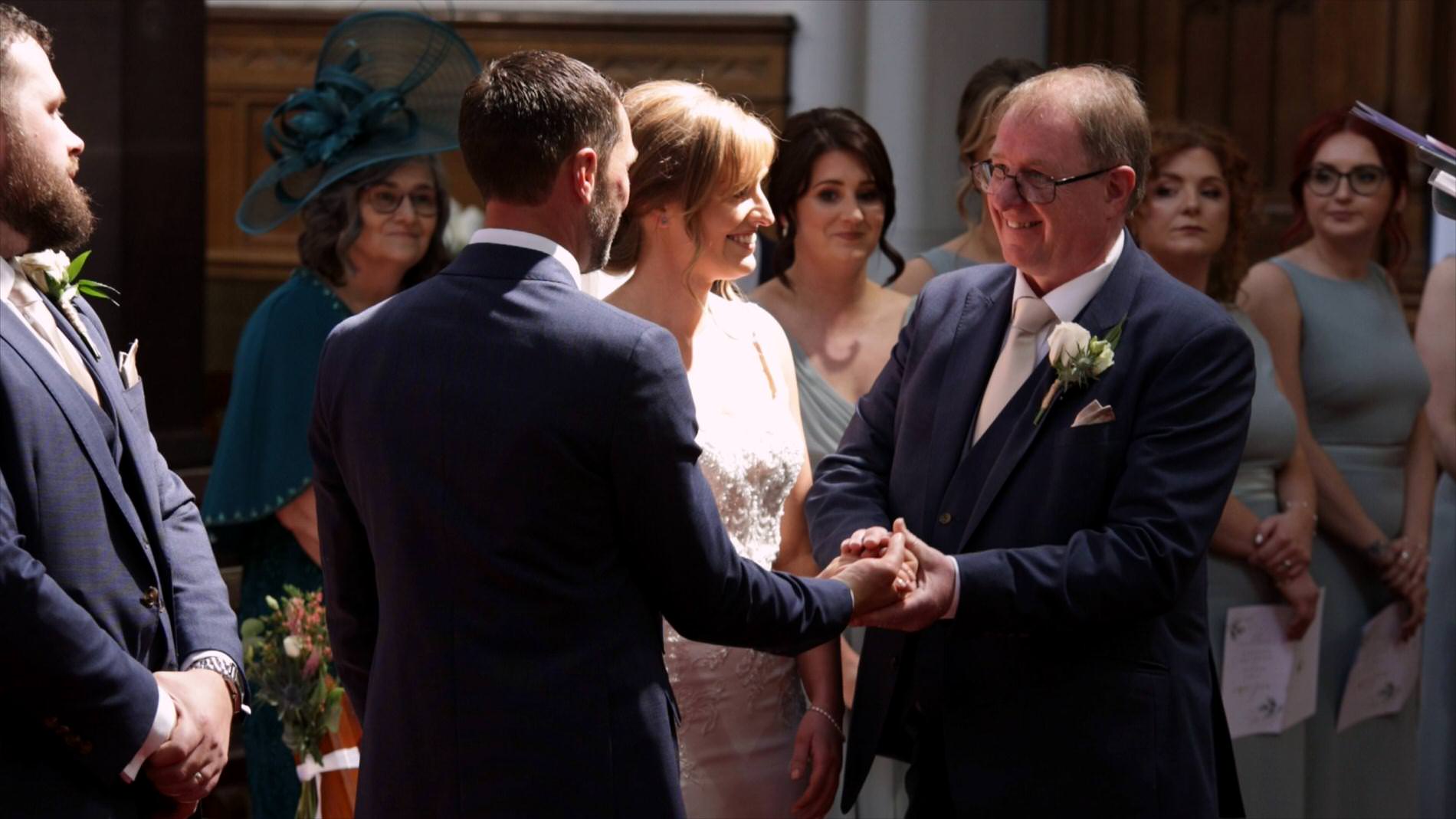 dad hands over his daughter during wedding ceremony at St Werburgh's Church
