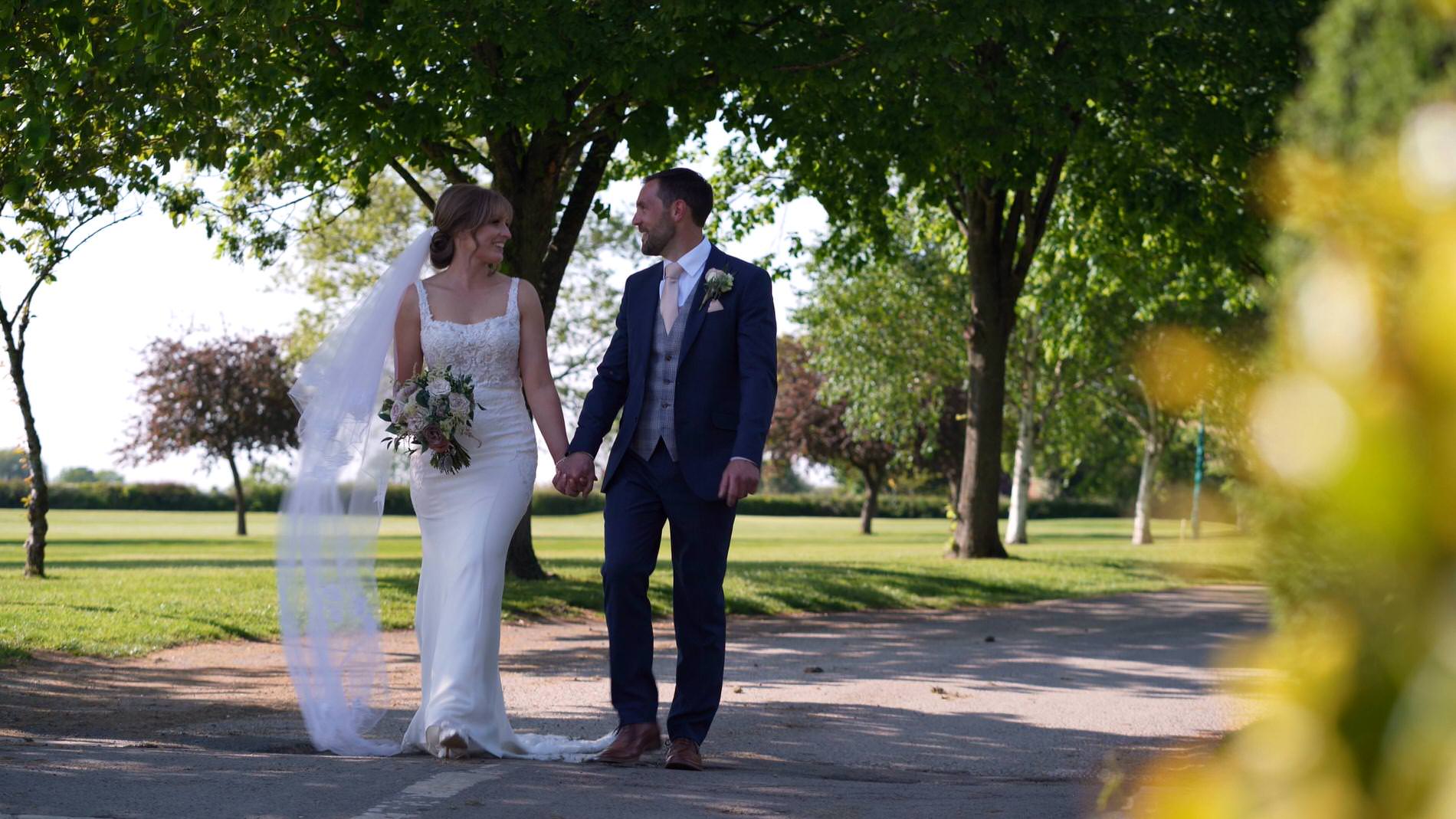 a couple walk down the path at Pryors Hayes Golf Club