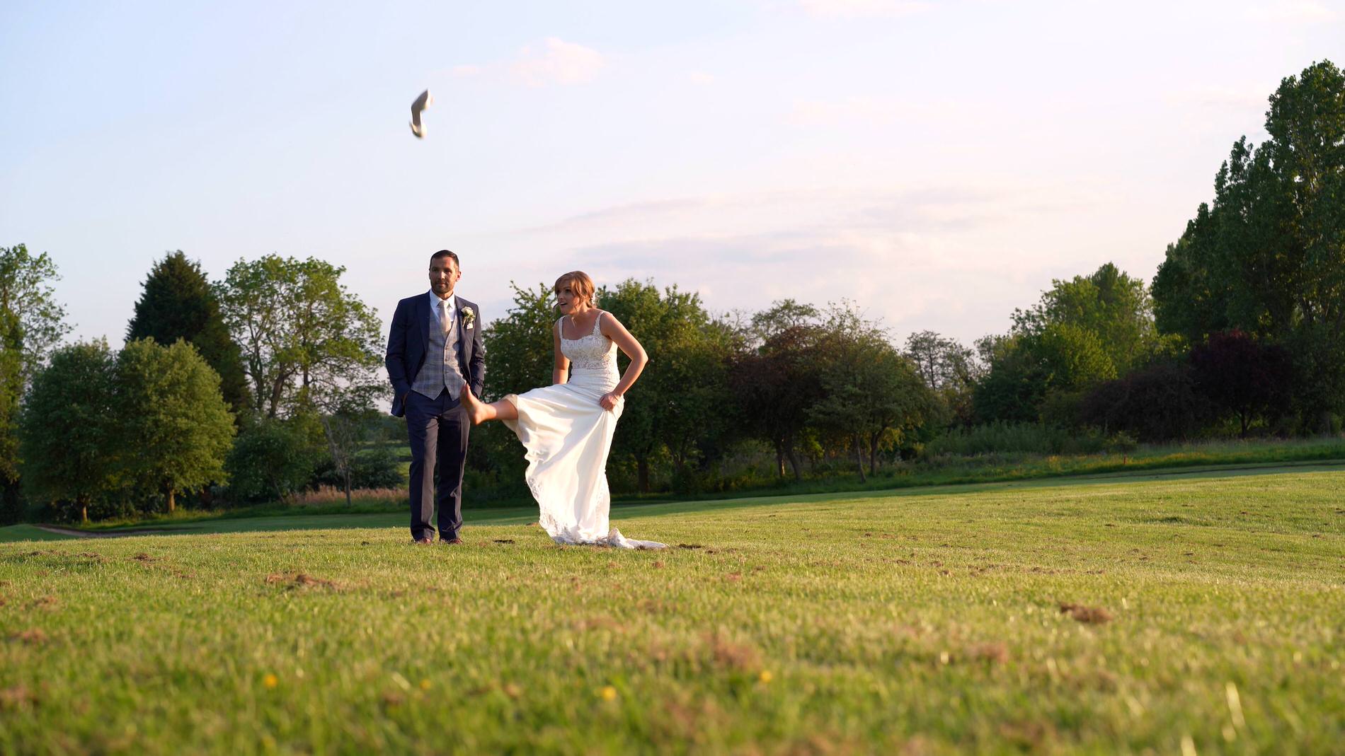 the bride kicks off her wedding shoes before filming