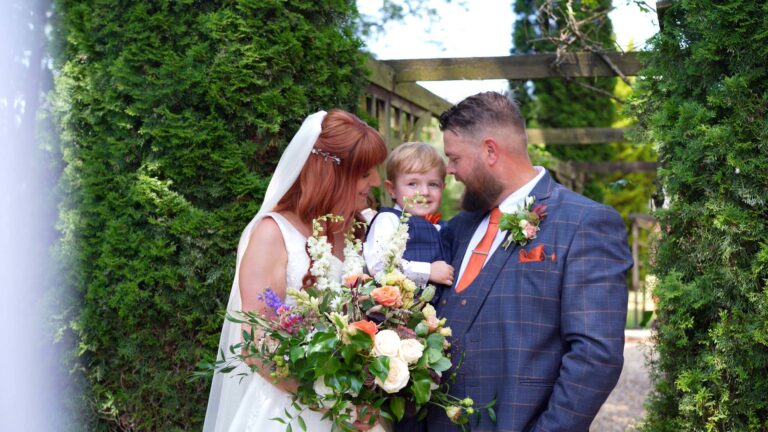 the couple cuddle their son during photos at Nunsmere hall