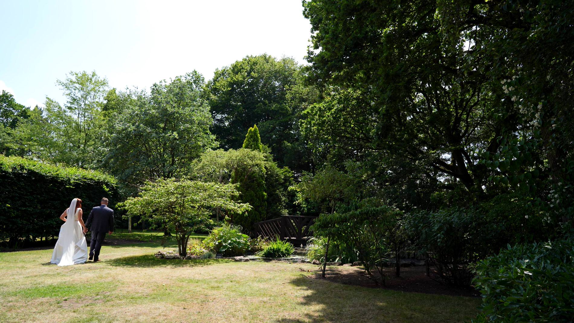 the couple take a walk around the gardens at Nunsmere hall