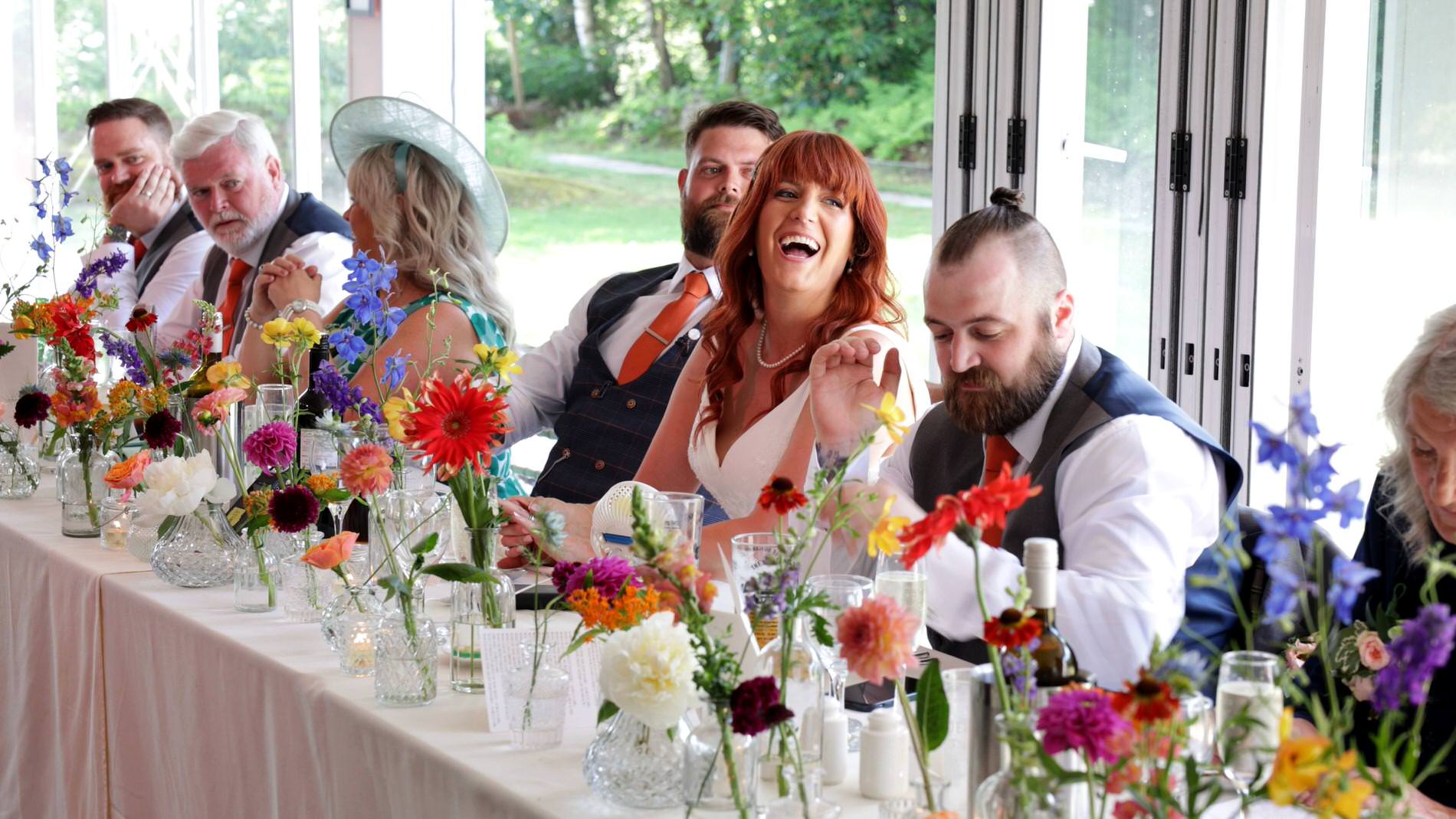 the bride laughs during her bridesmaids wedding speech at Nunsmere hall