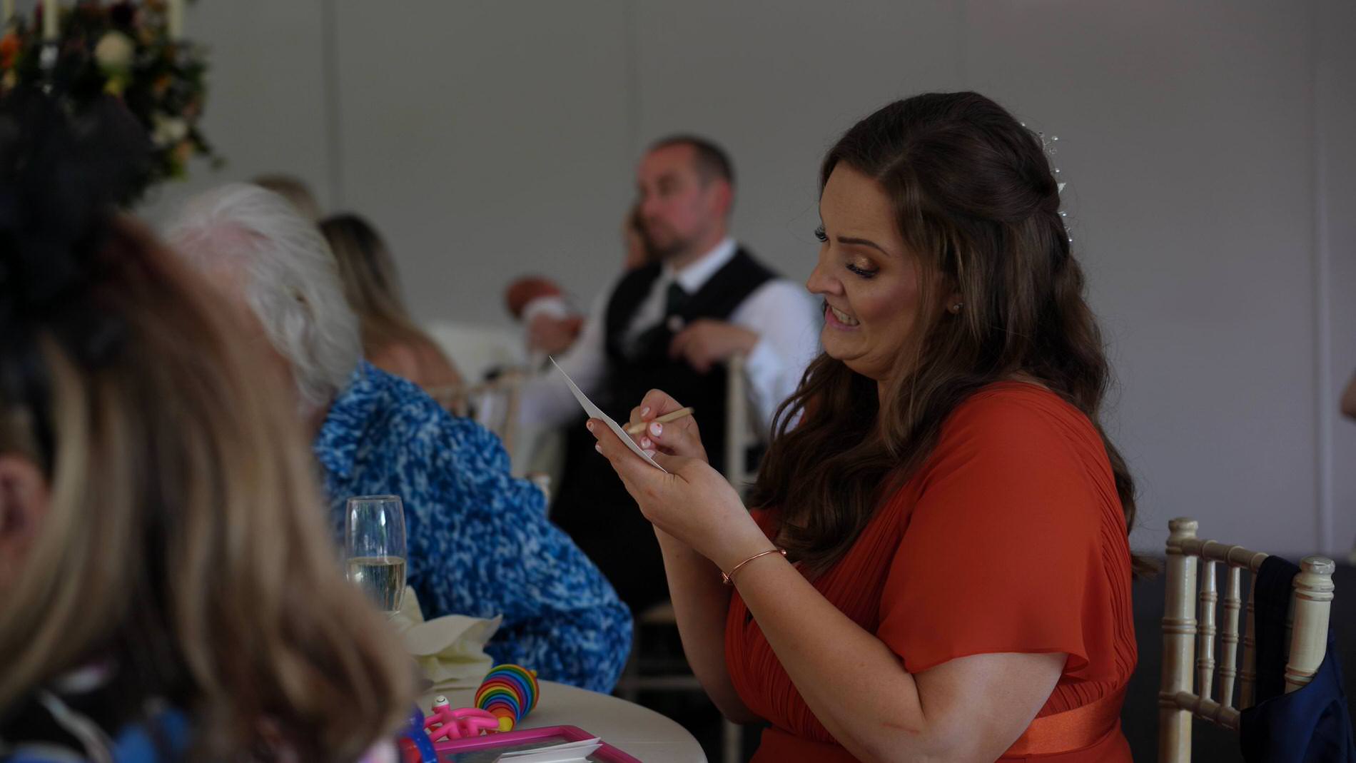 a guest fills in the mr and mrs game card