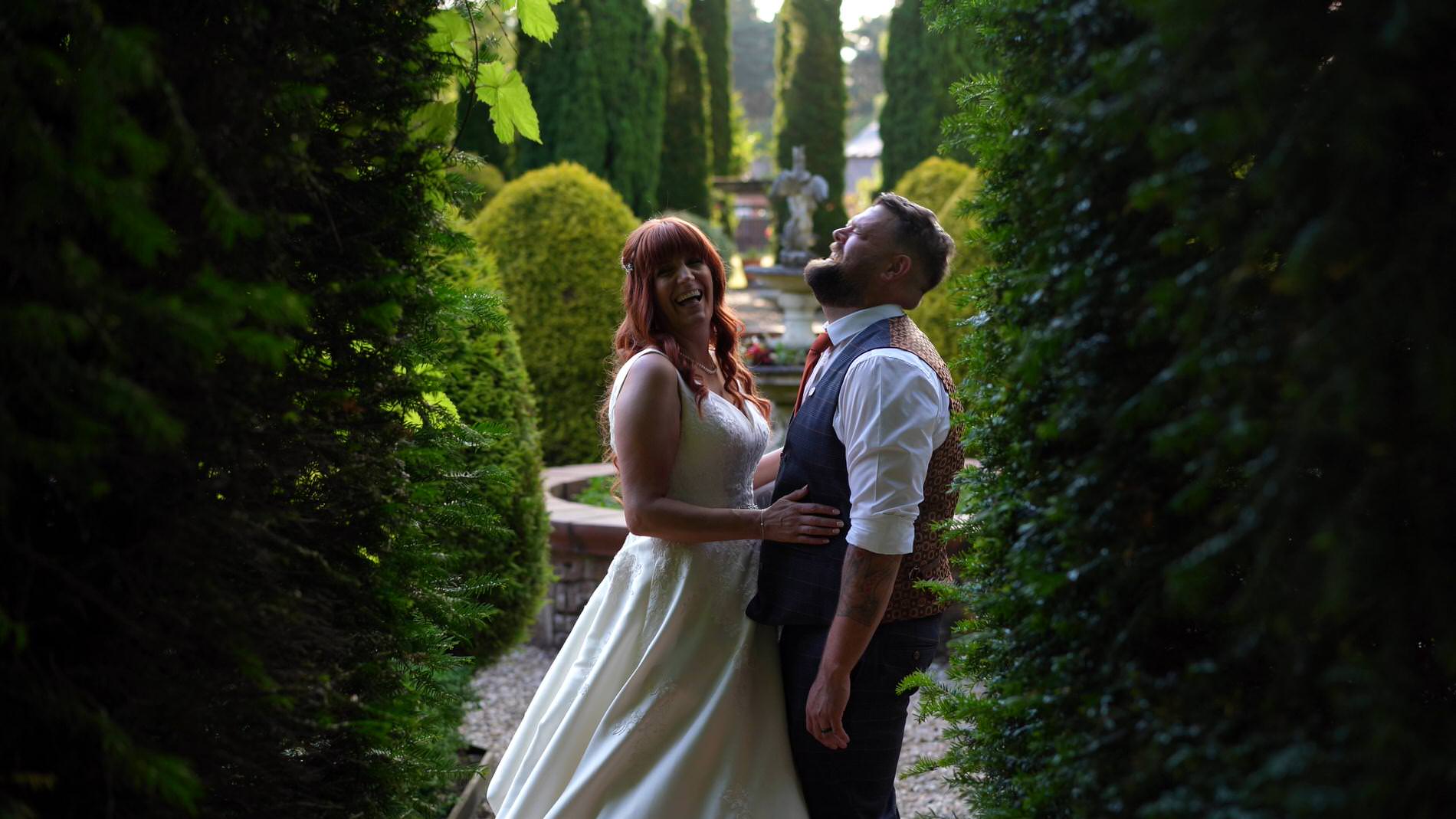 the couple belly laugh during video at Nunsmere hall