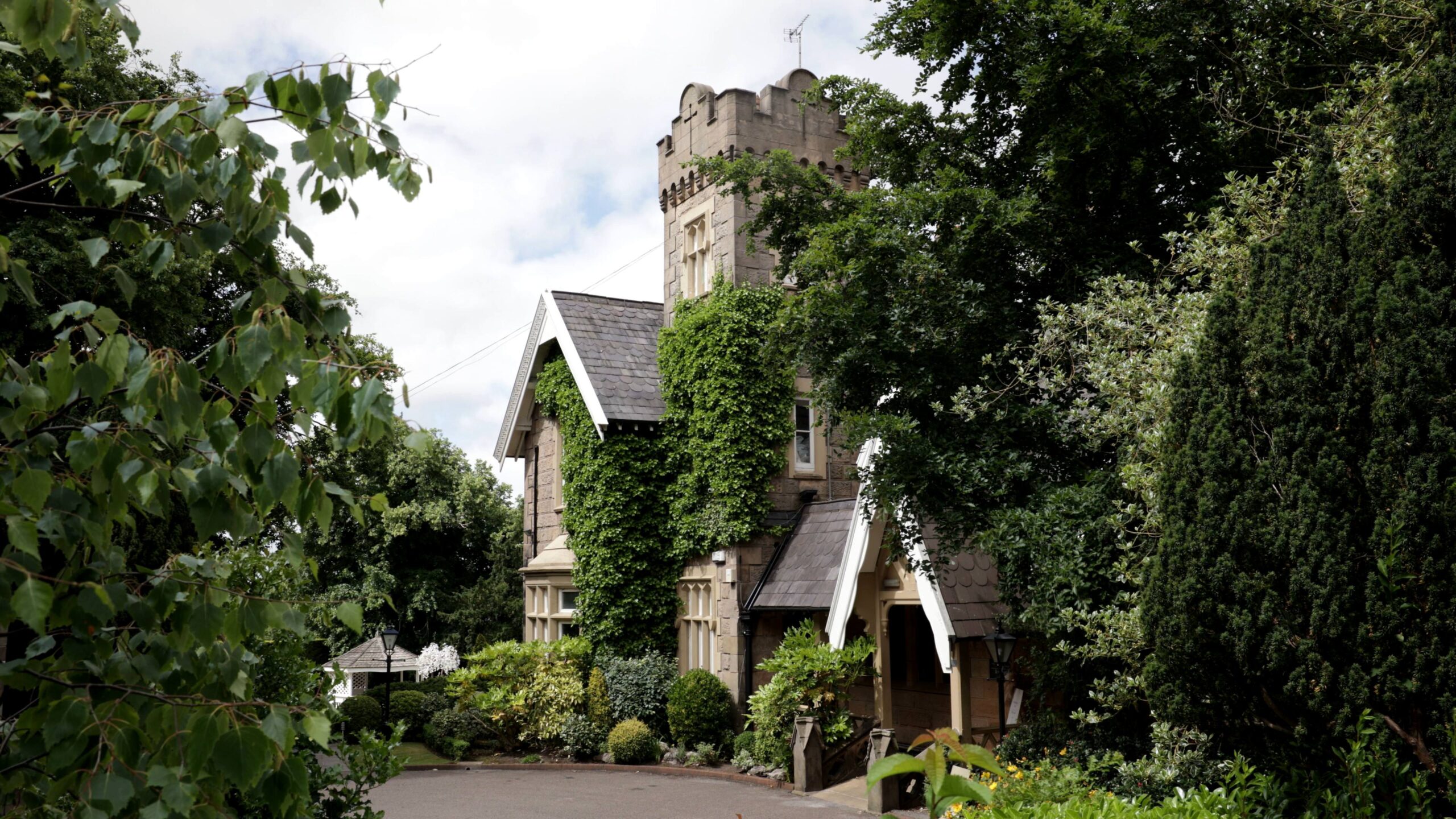 shot of west tower wedding venue through the trees