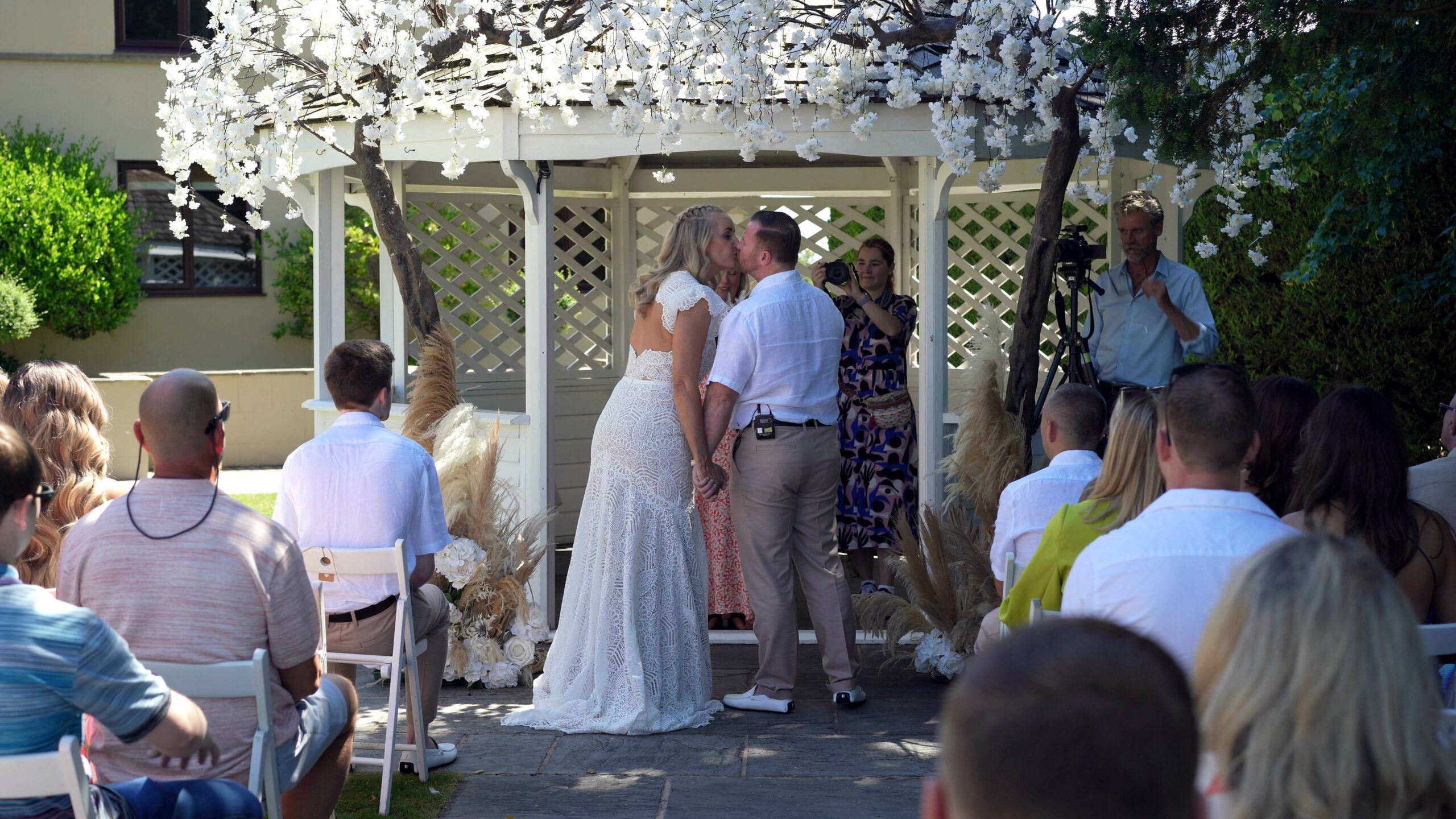 a couple kiss outside the west tower during vow renewal
