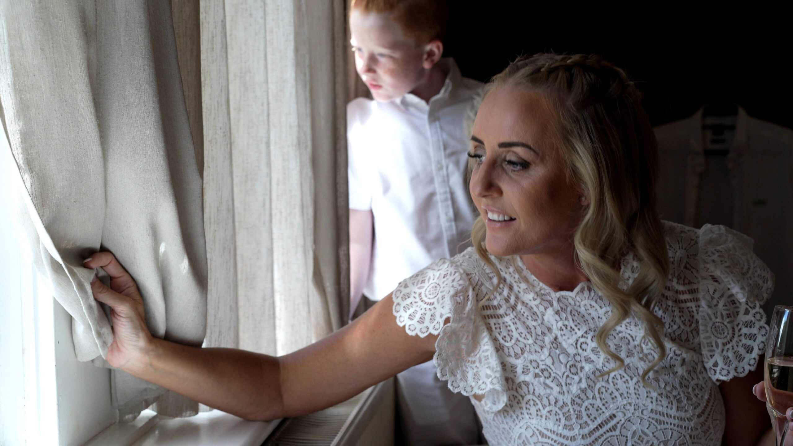 a video still of the bride looking out to the outdoor ceremony at west tower