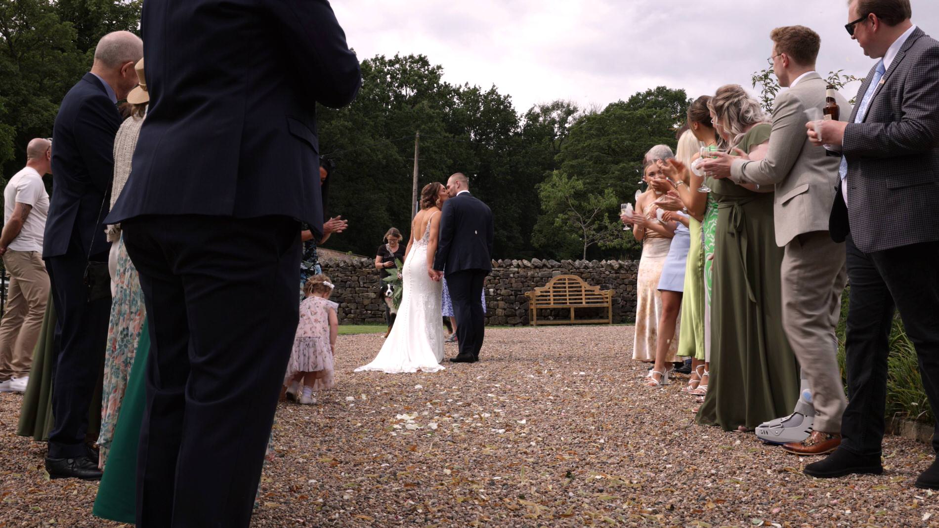 the couple kiss after confetti