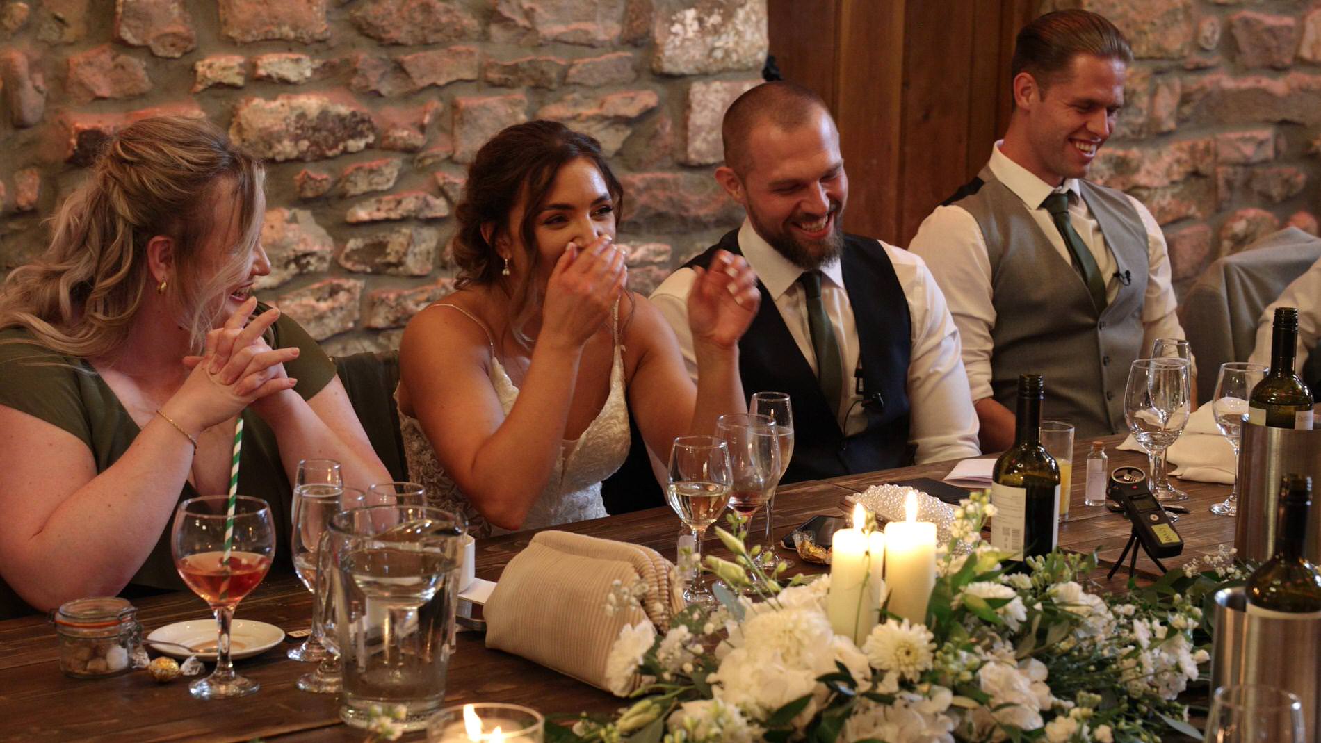 the couple laugh at the father of the bride speech