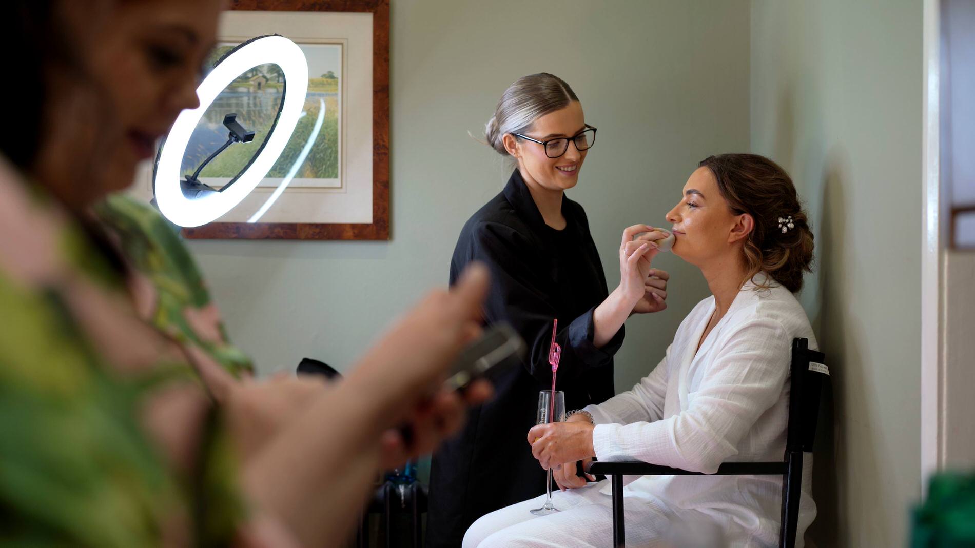 bride gets her makeup done at Browsholme Hall