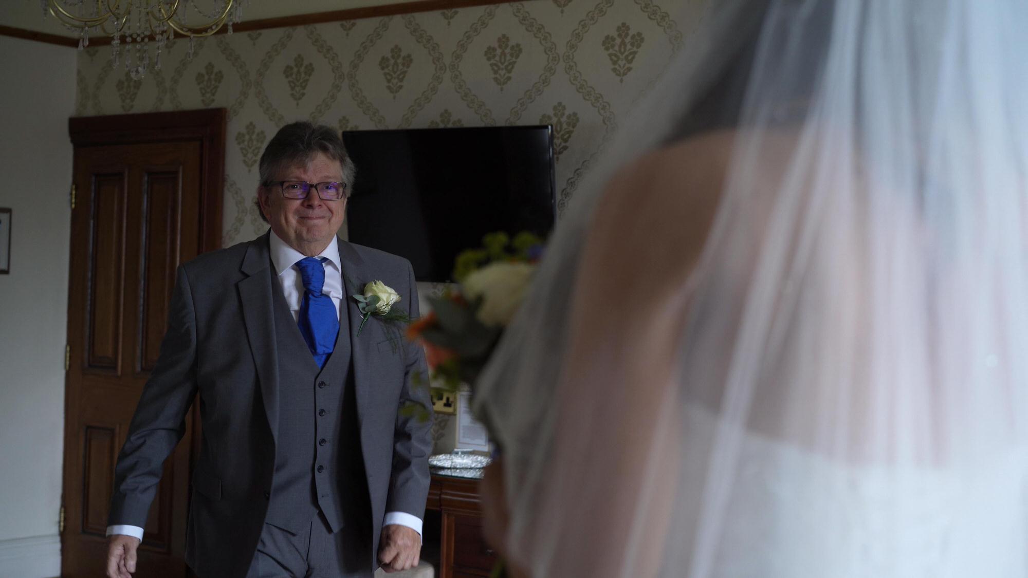 a father of the bride sees his daughter for the first time at West Tower