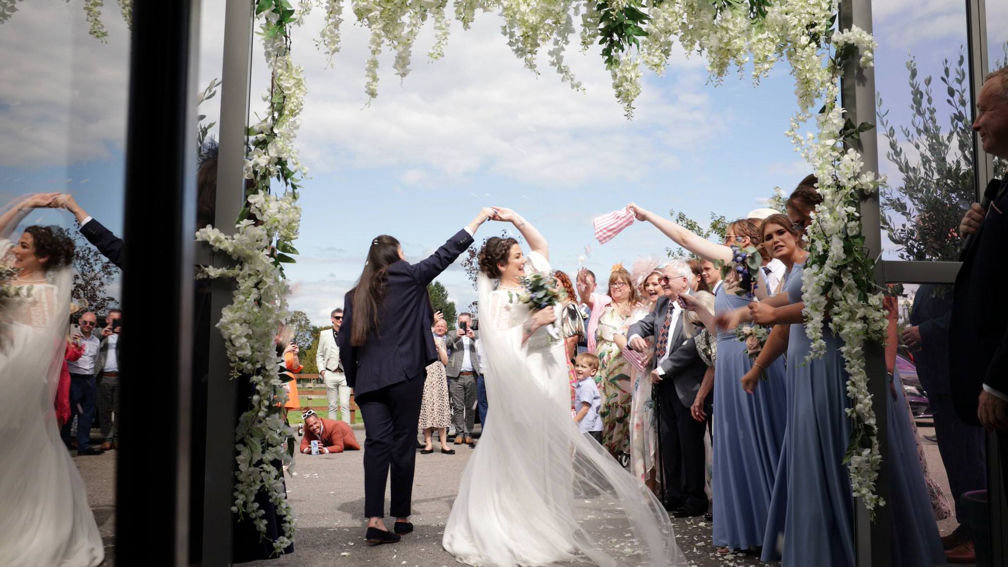 the couple dance outside The Aviary in Ormskirk showered in confetti