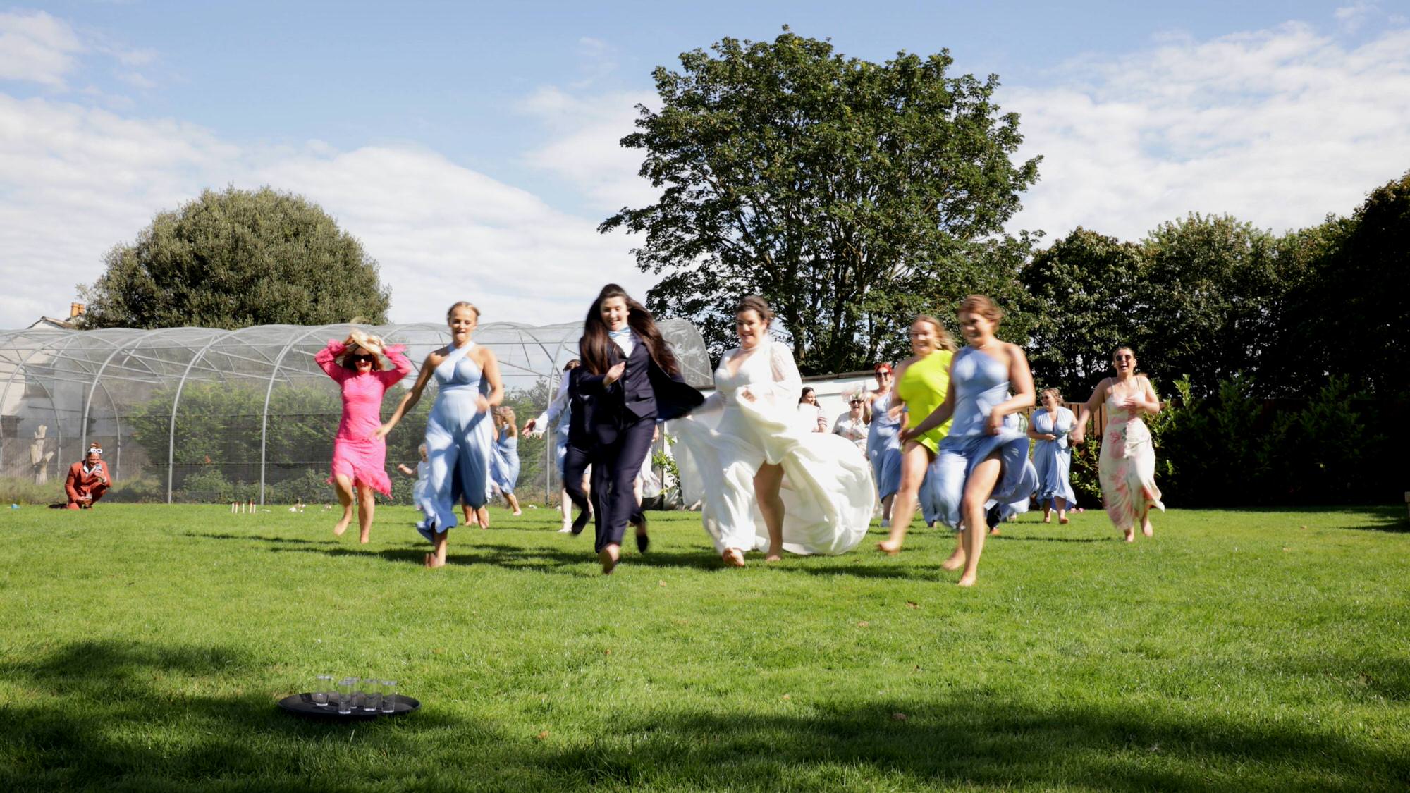guests play a game to run to the sambuca shots at a wedding
