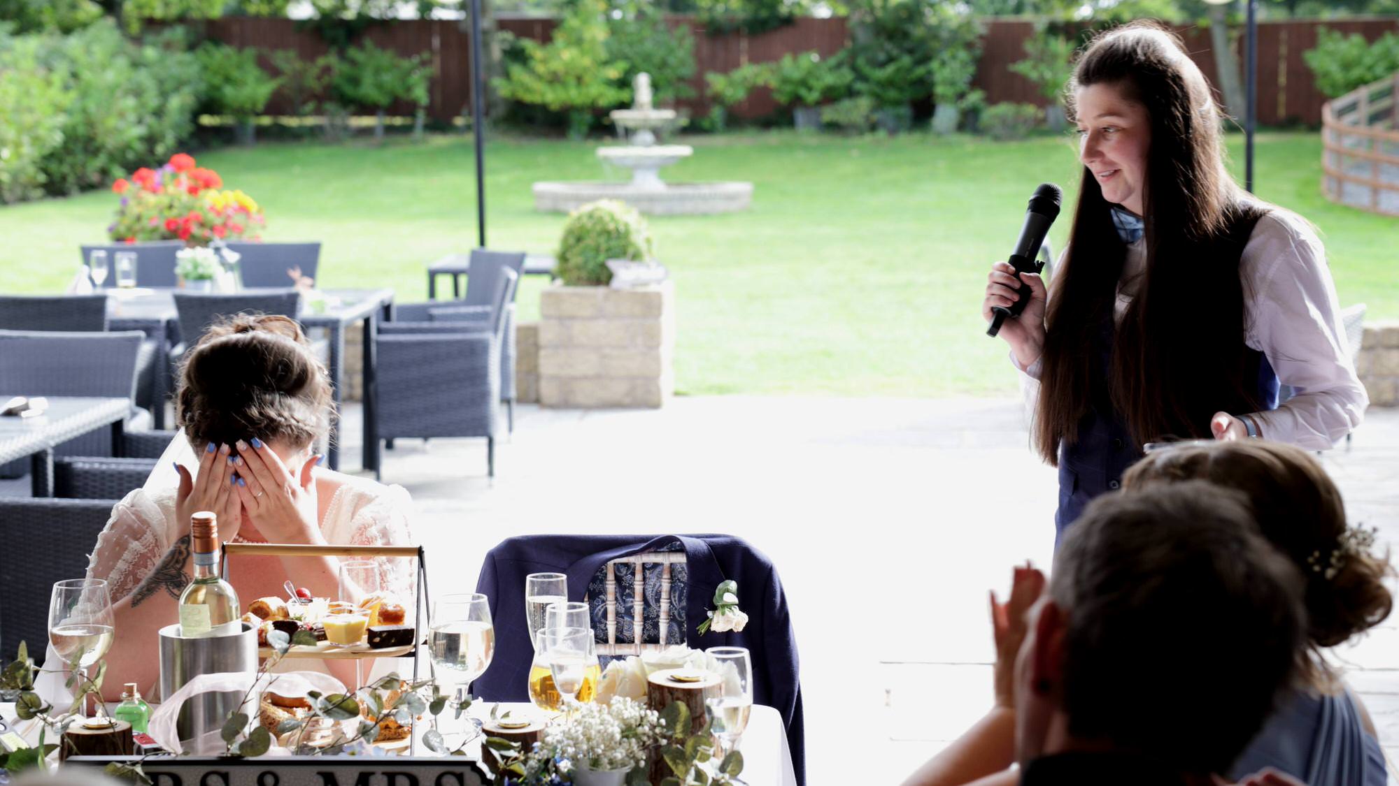 a video still of an emotional brides speech to her wife at The Aviary