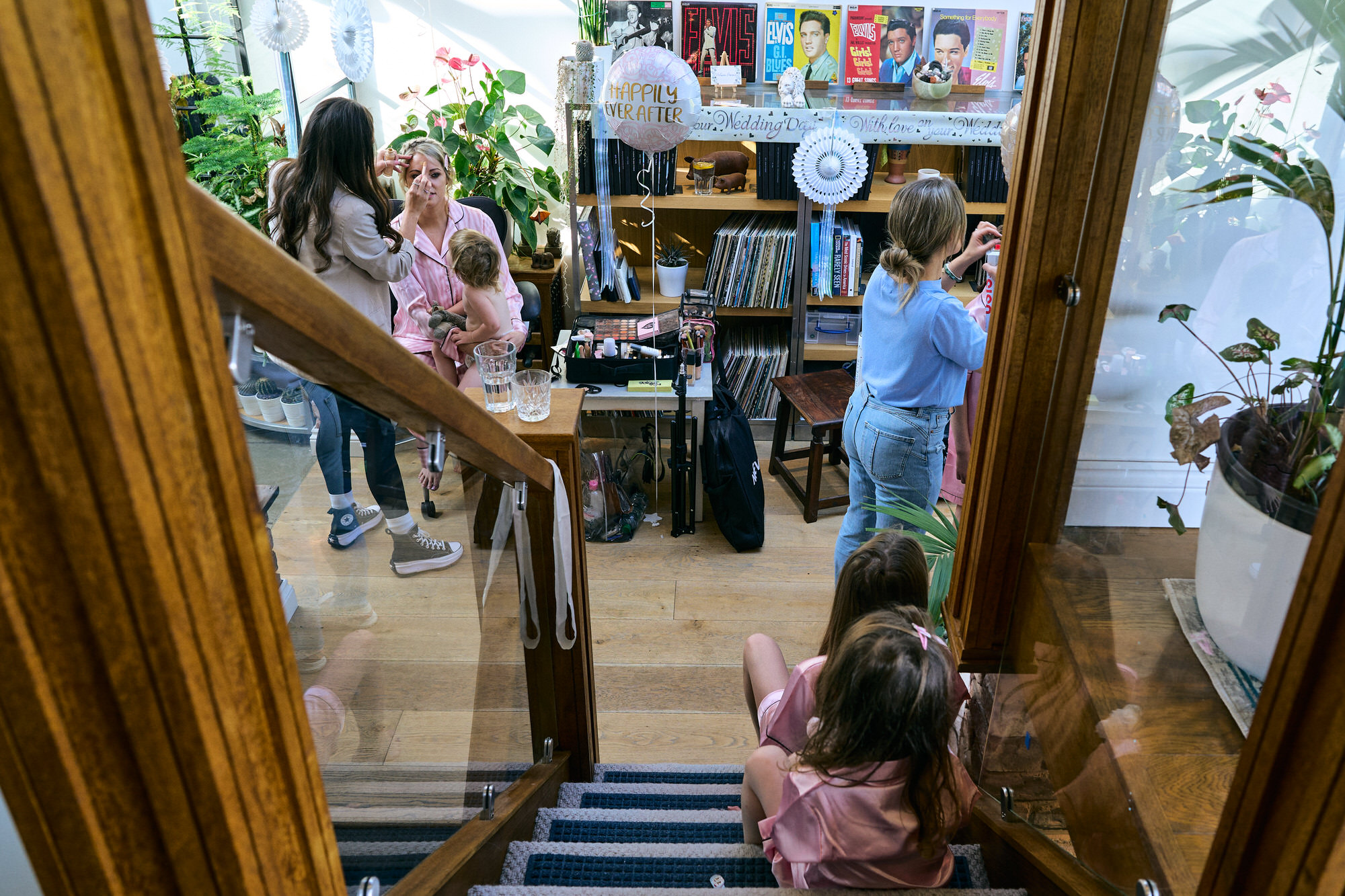 a bride gets ready at her parents in Birkdale with children watching