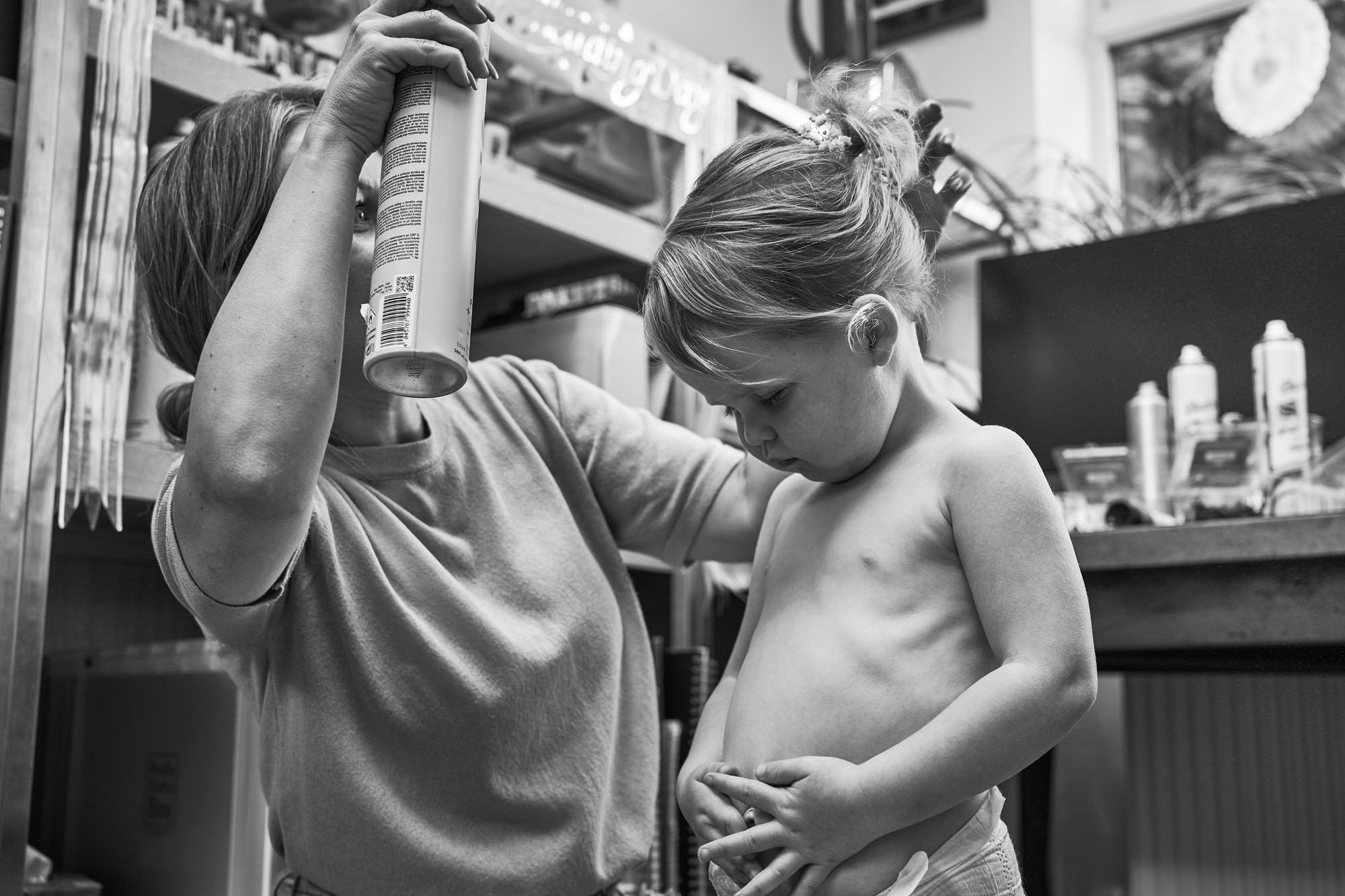 a video still of a flower girl getting her hair done for her Mums wedding