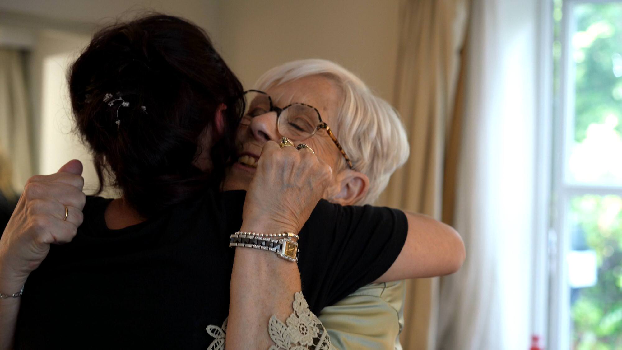 a bride hugs her grandma on the wedding morning