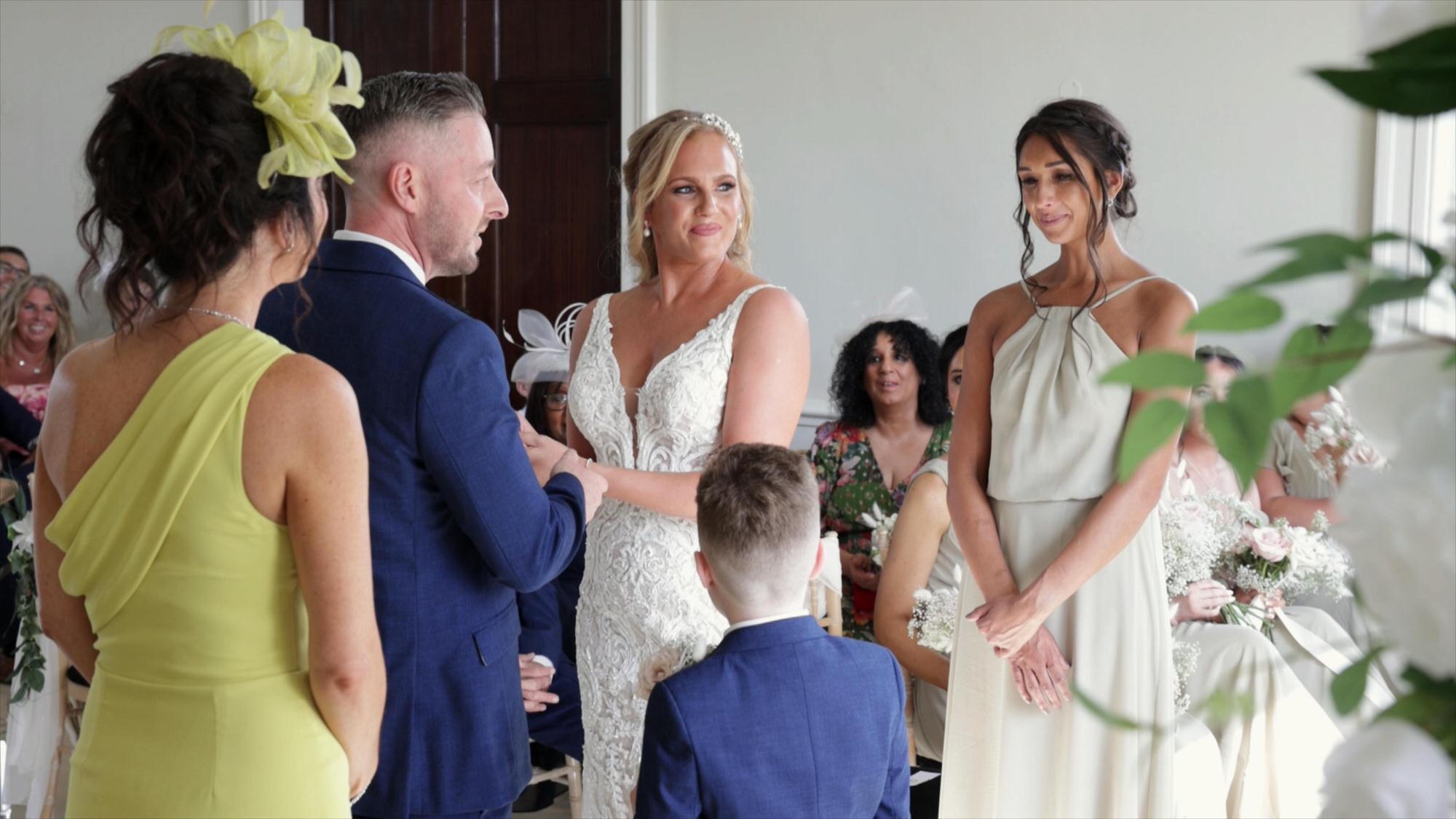 a couple exchange wedding rings during wedding ceremony