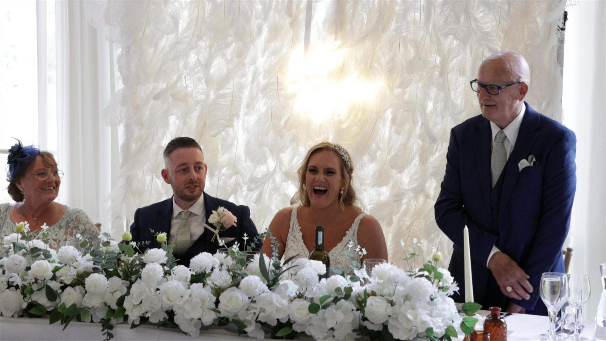 the brides grandad stands to give an emotional speech