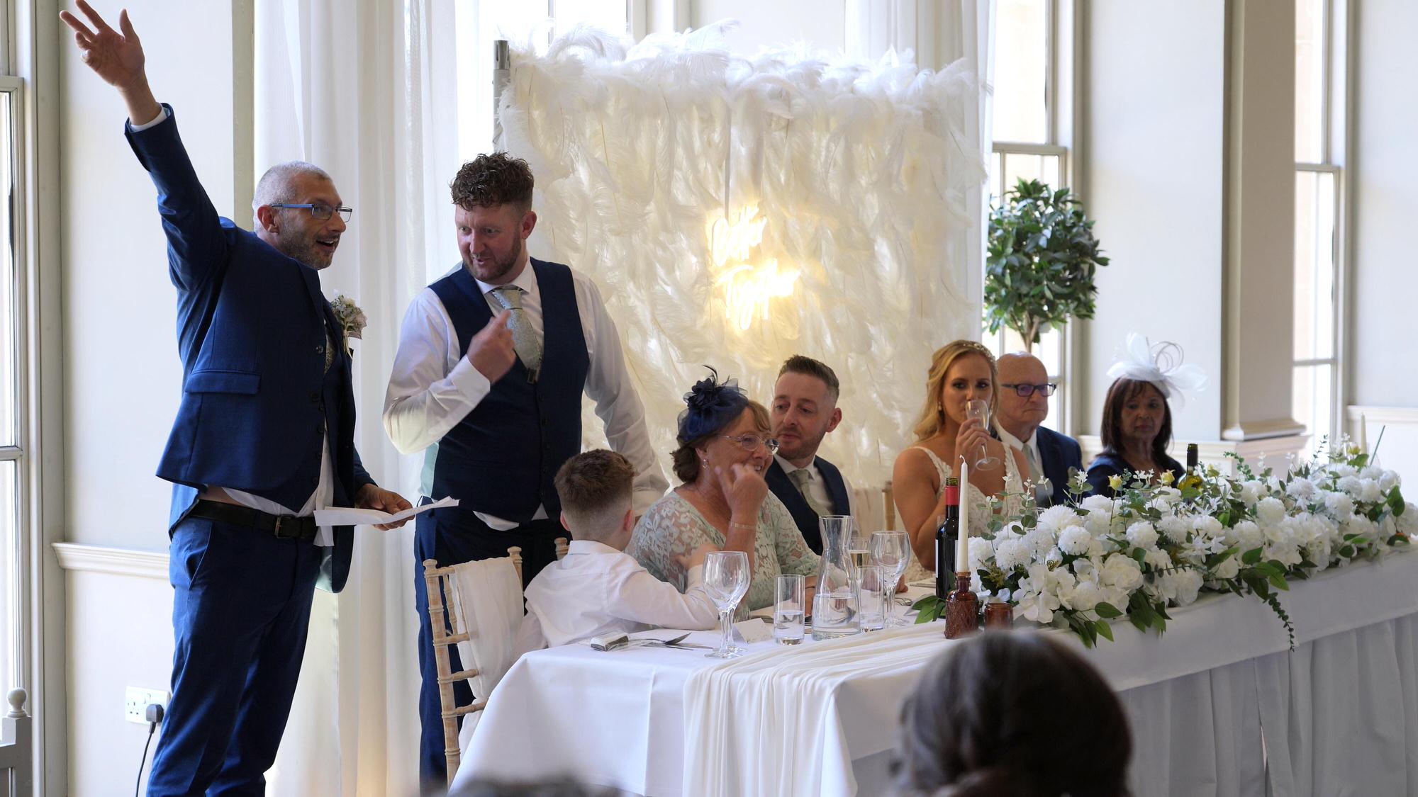 two best men stand for a wedding speech