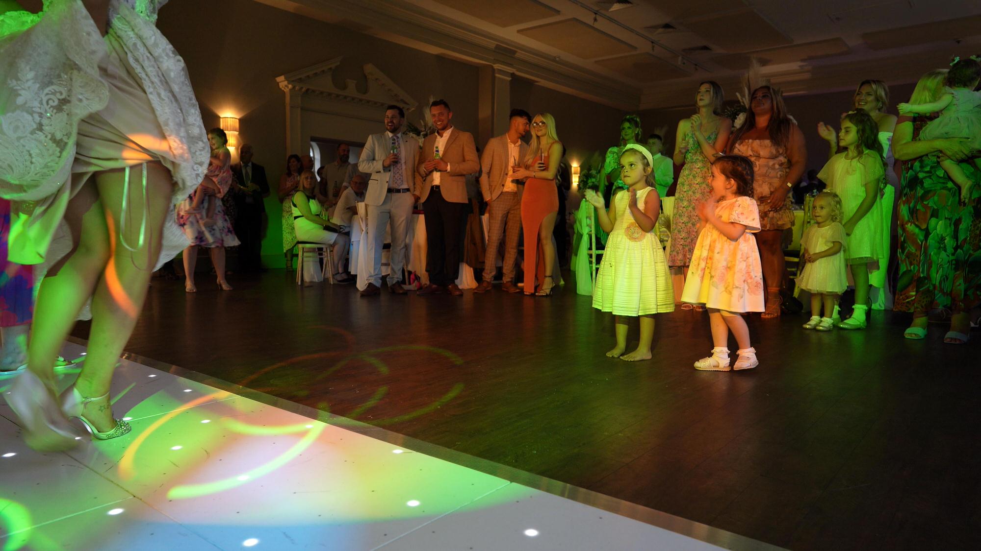 guests watch brides squad dancing to Jerusalema