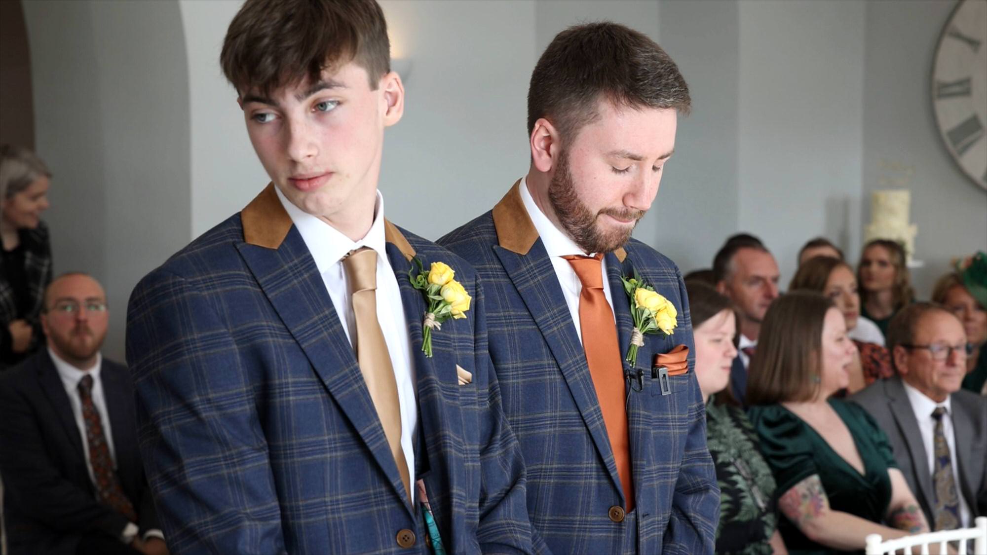 a groom nervously waits for the wedding ceremony to start in Cartmel