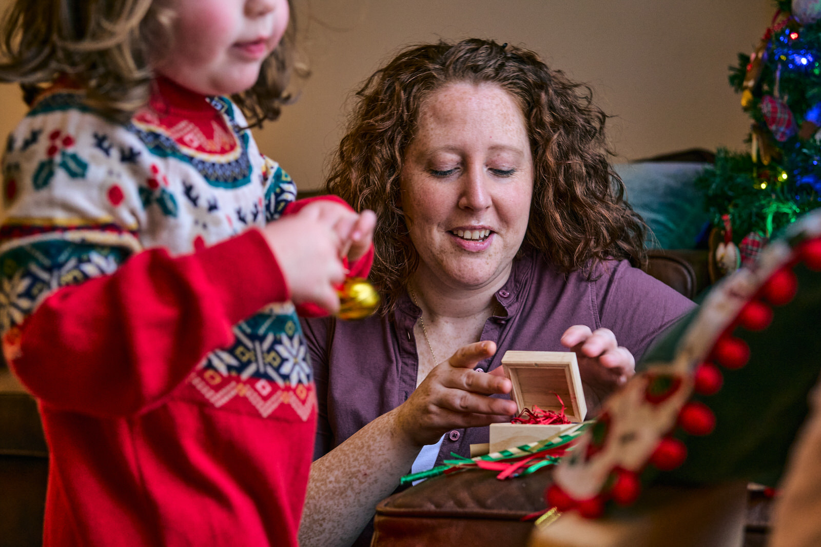 mum glances at the santas bell in the Christmas eve box
