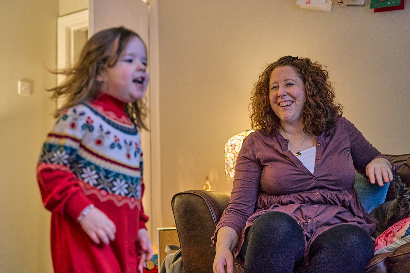 a mum dances to christmas songs with her daughter