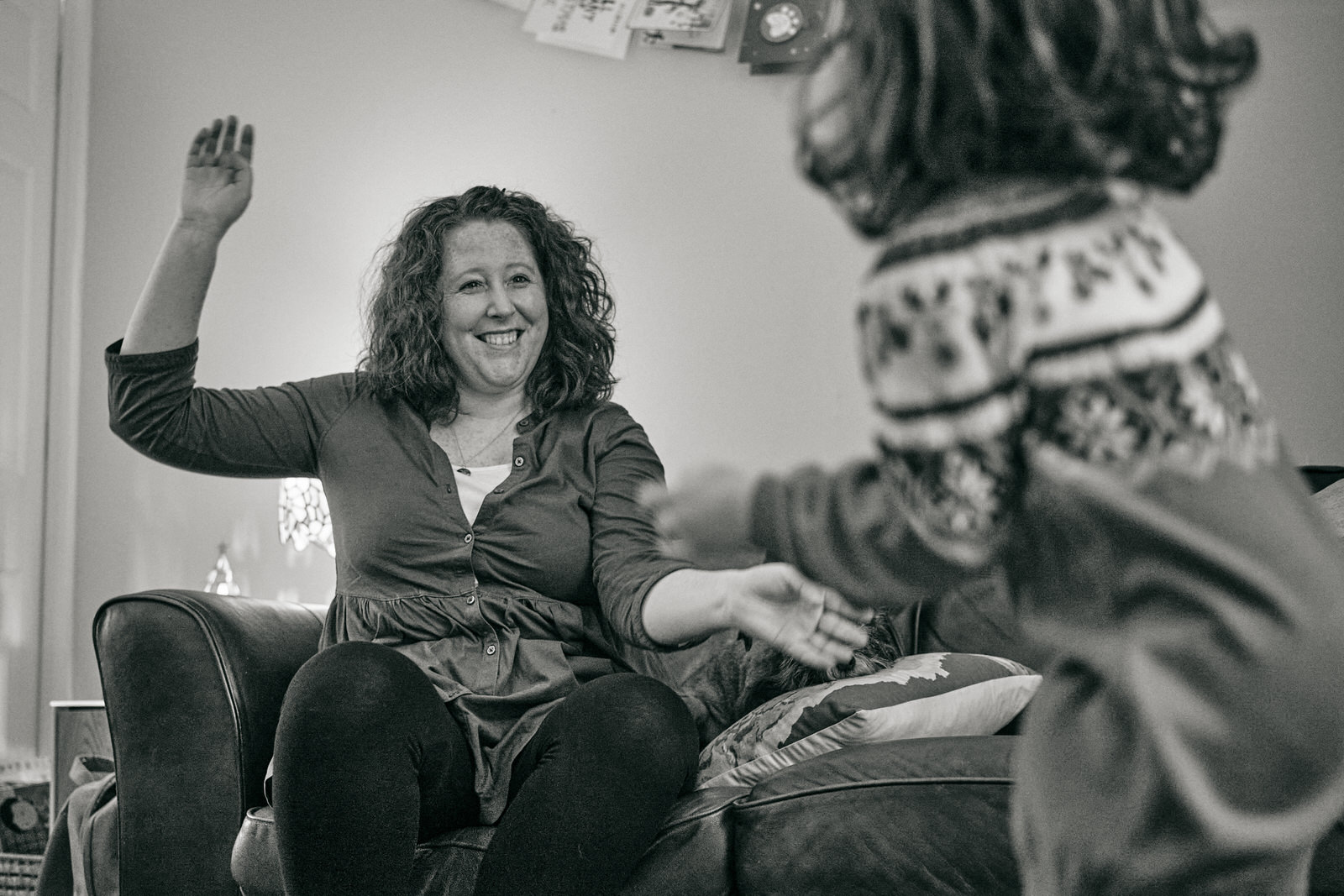 a natural photo of a mum dancing to christmas songs at home