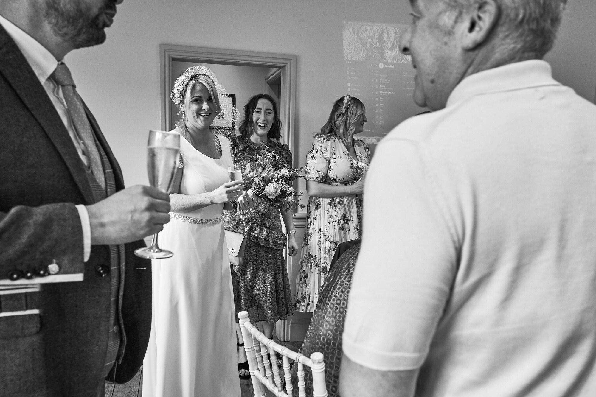 a photo of the bride looking and smiling at her groom