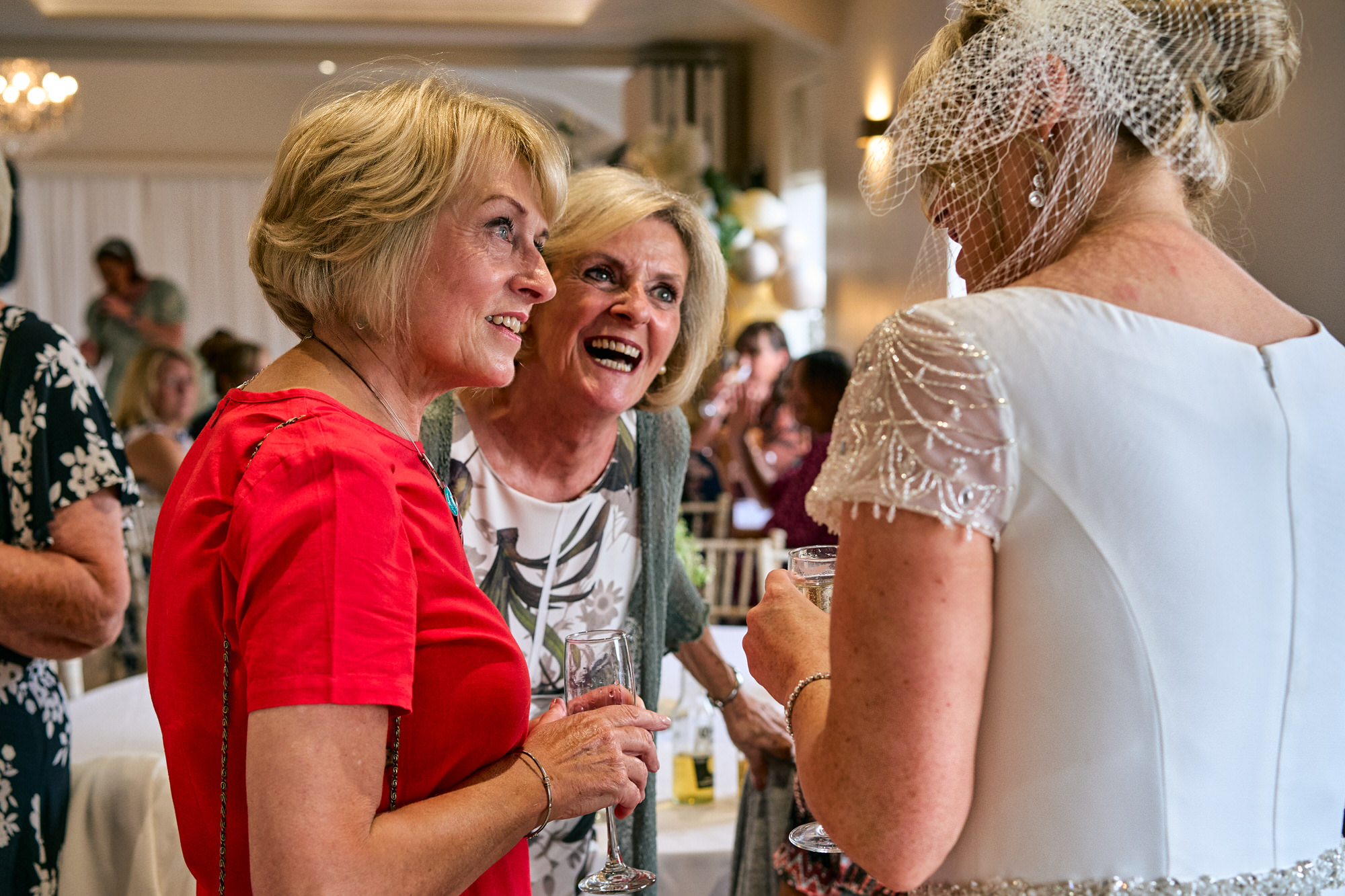elderly relatives chat to the bride
