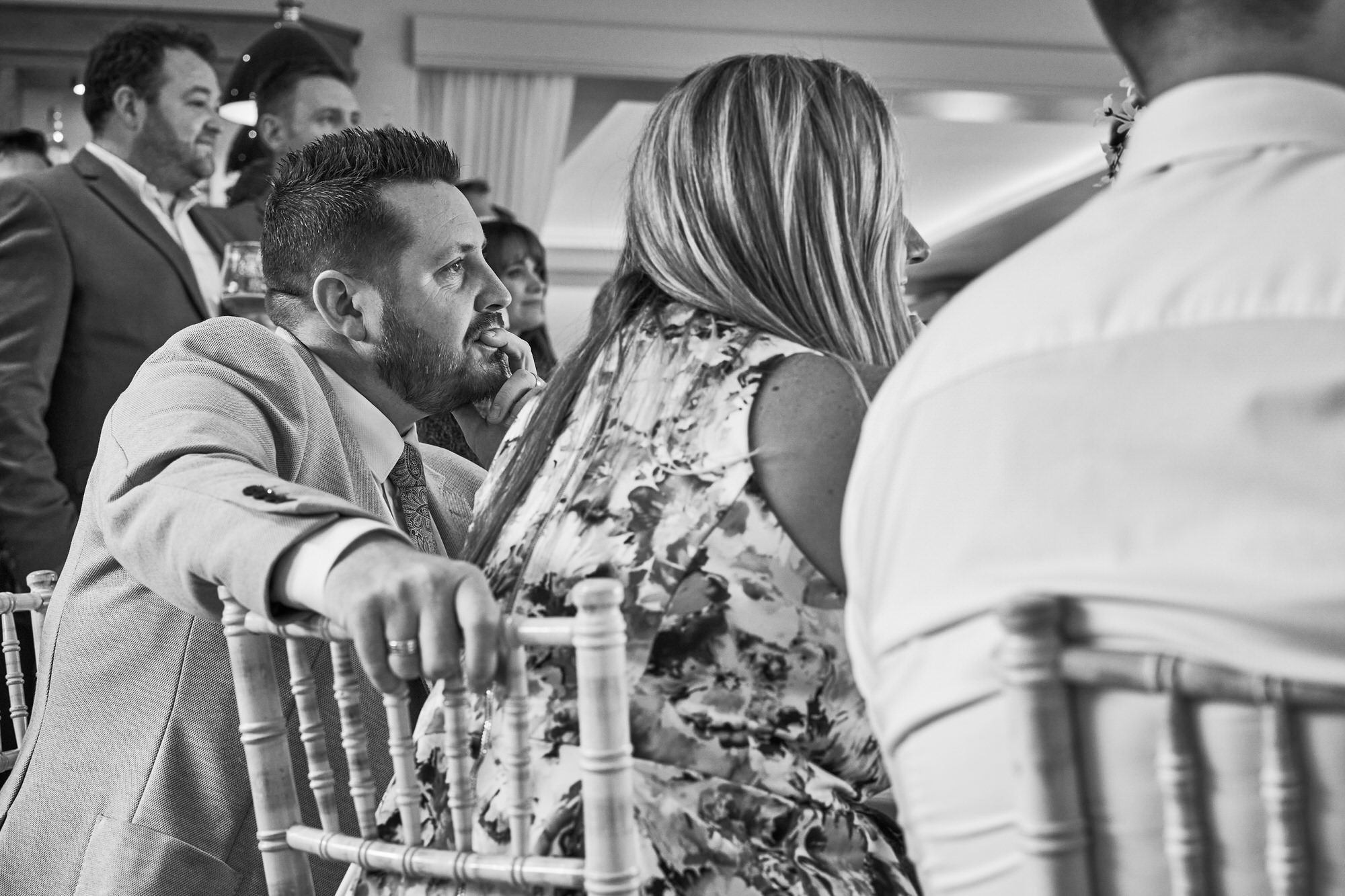 a guest looks emotional listening to the couples wedding vows at The Aviary Ormskirk