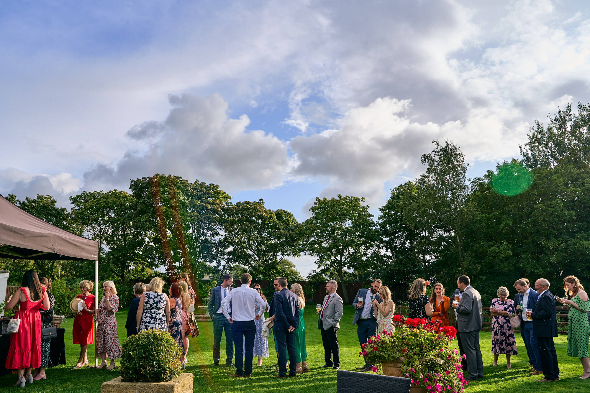 guests queue in the sunshine for the BBQ at The Aviary Ormskirk